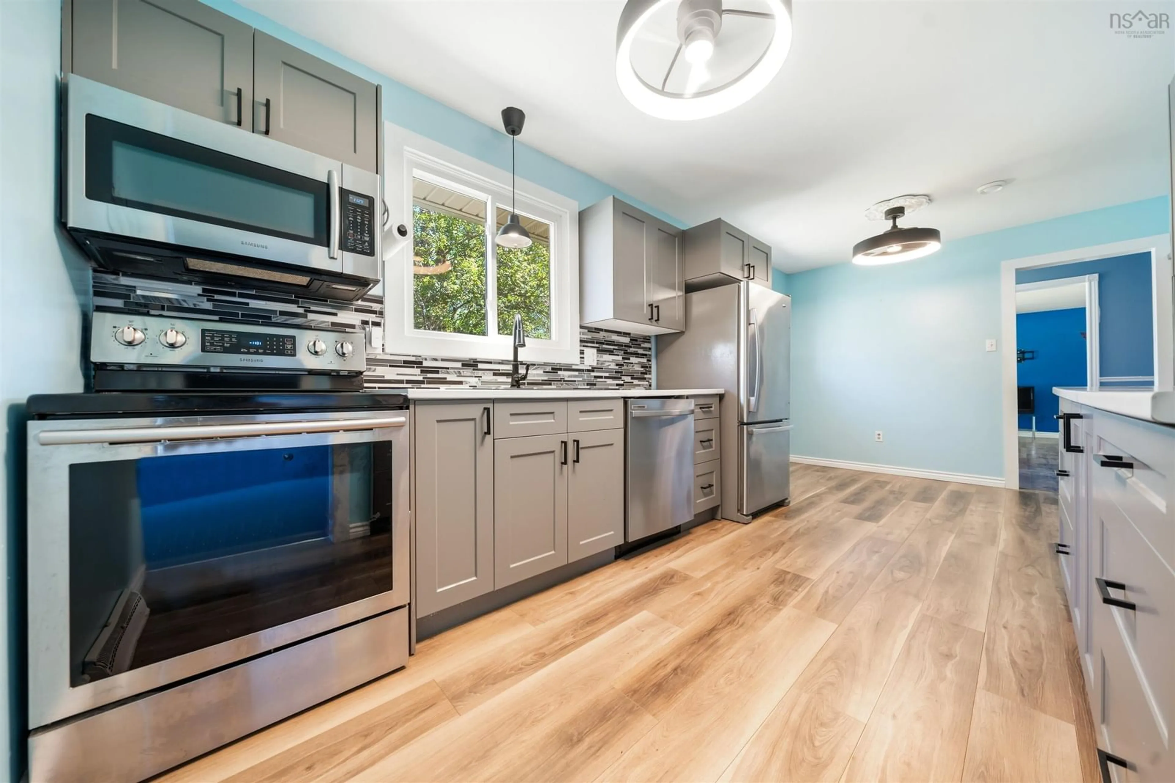 Open concept kitchen, wood/laminate floor for 125 Oxford St, Stellarton Nova Scotia B0K 1S0