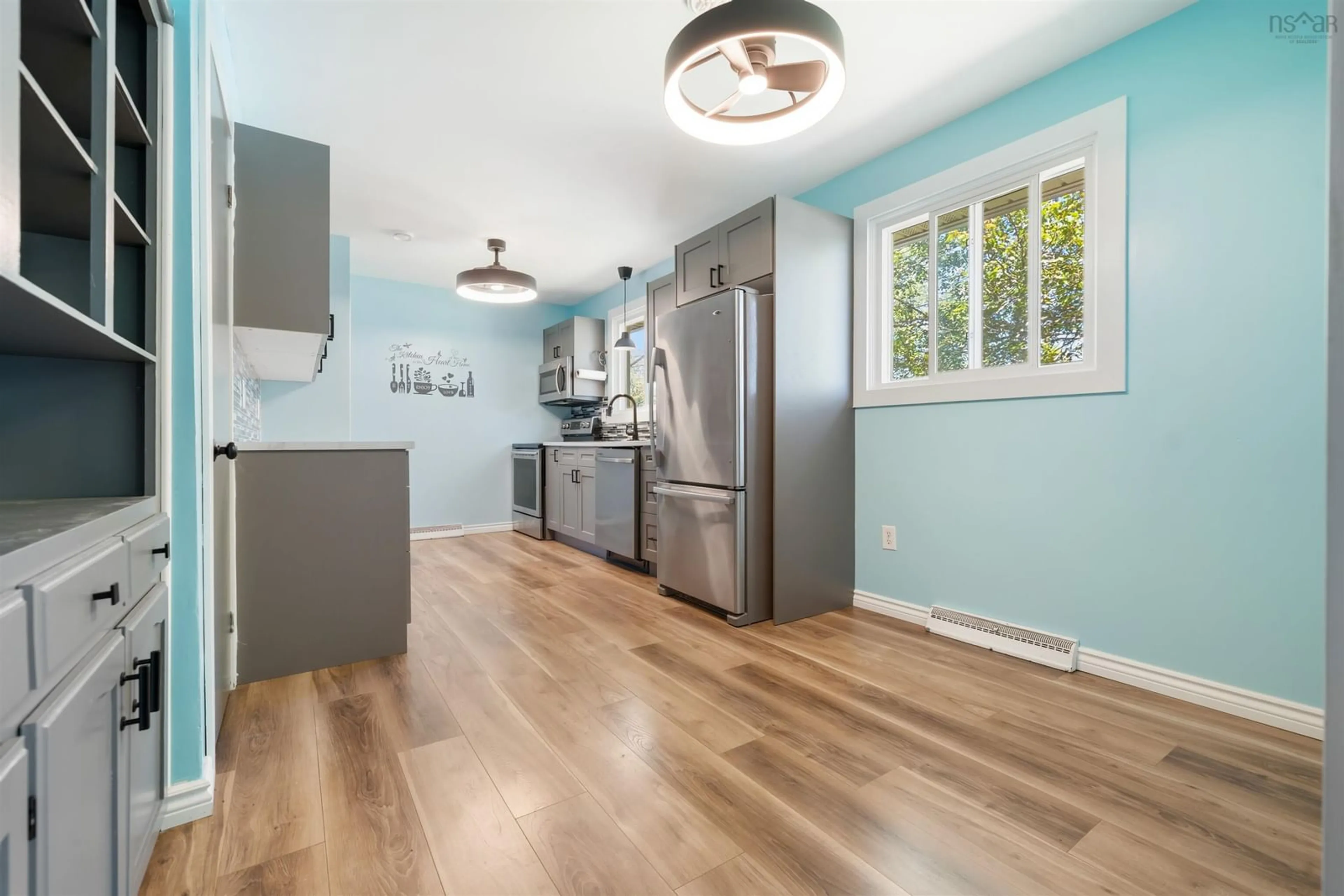 Open concept kitchen, wood/laminate floor for 125 Oxford St, Stellarton Nova Scotia B0K 1S0