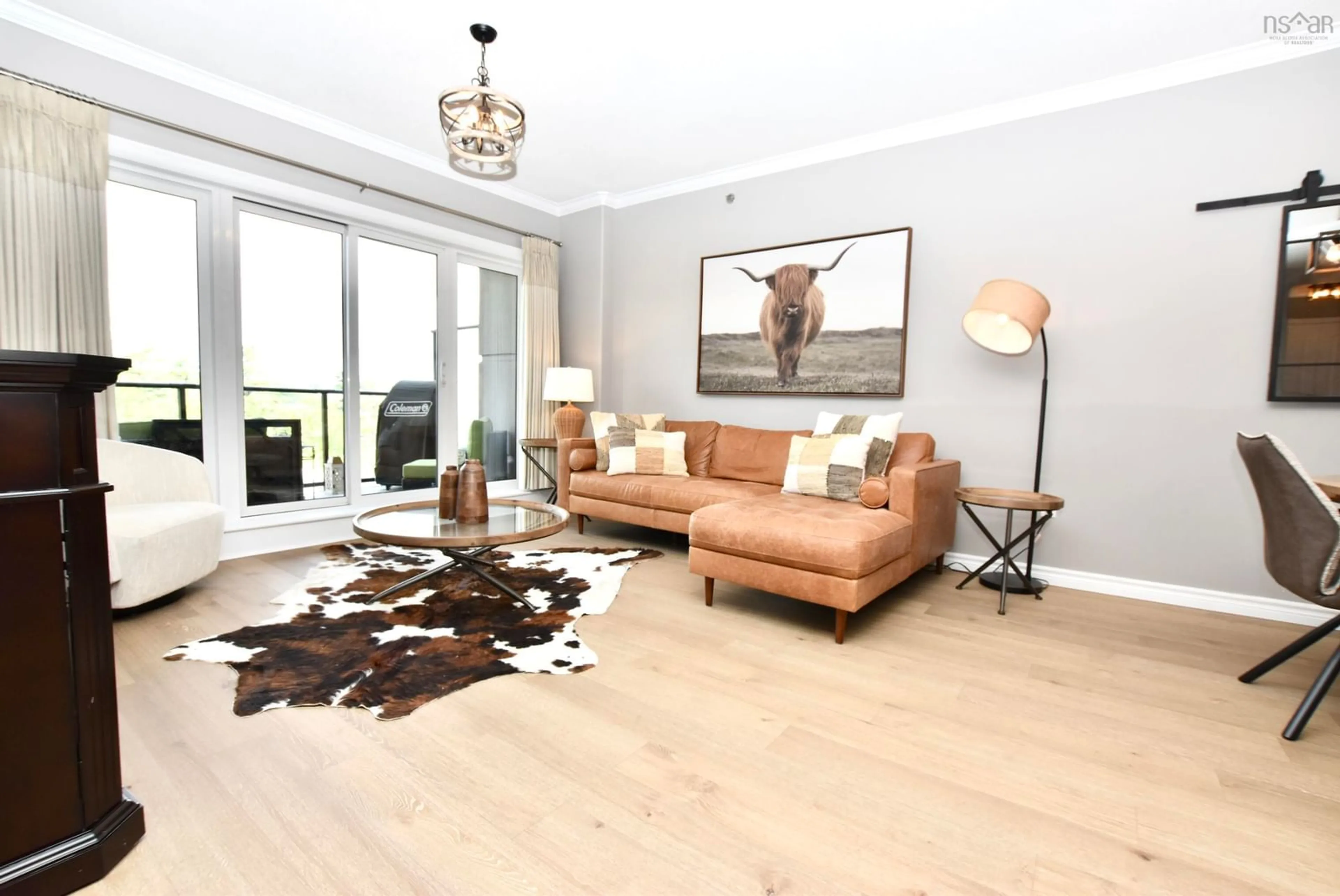 Living room with furniture, wood/laminate floor for 36 Southgate Dr #209, Bedford South Nova Scotia B3M 4B5