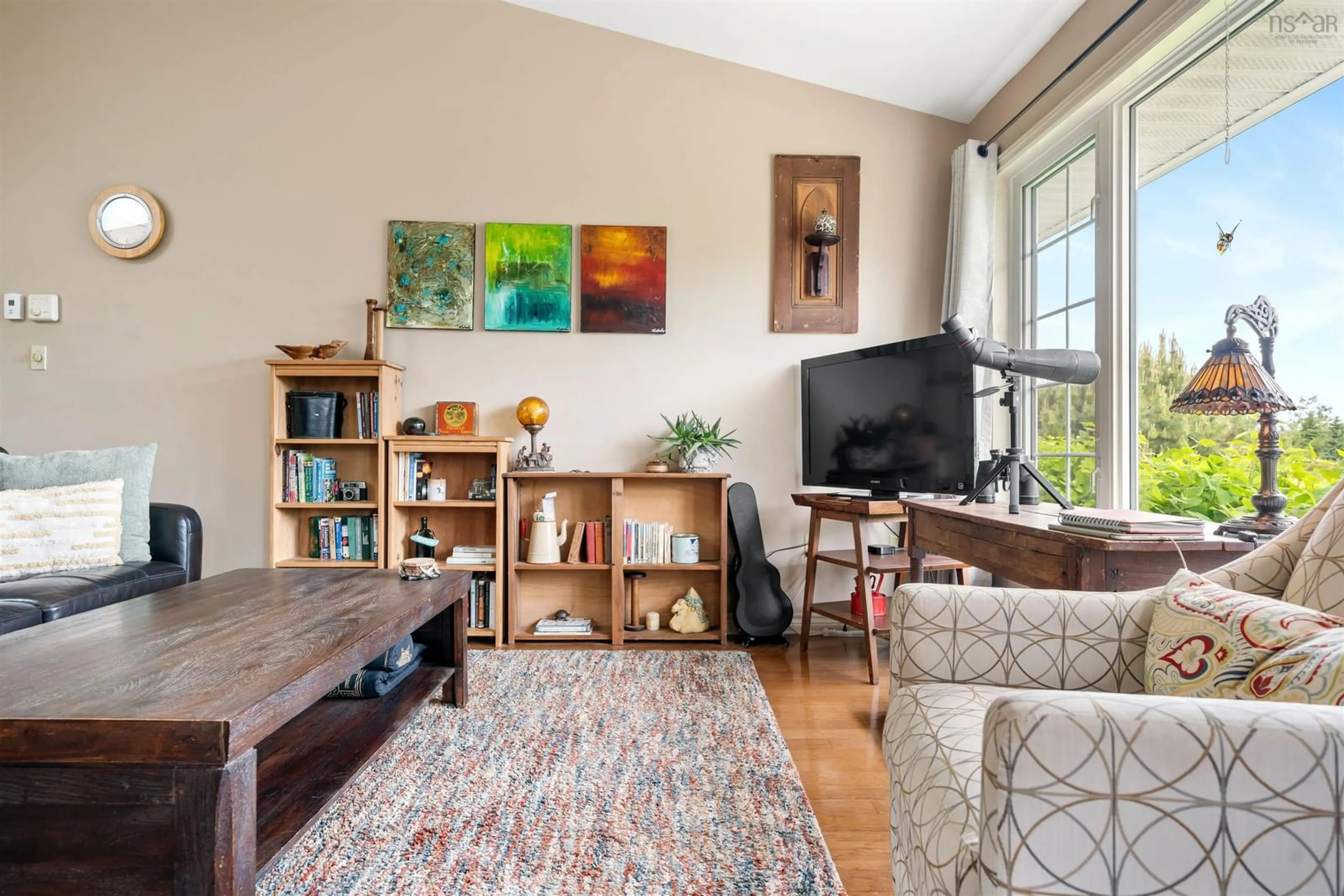 Living room with furniture, wood/laminate floor for 39 Arrow Head Cres, Waterside Nova Scotia B0K 1H0