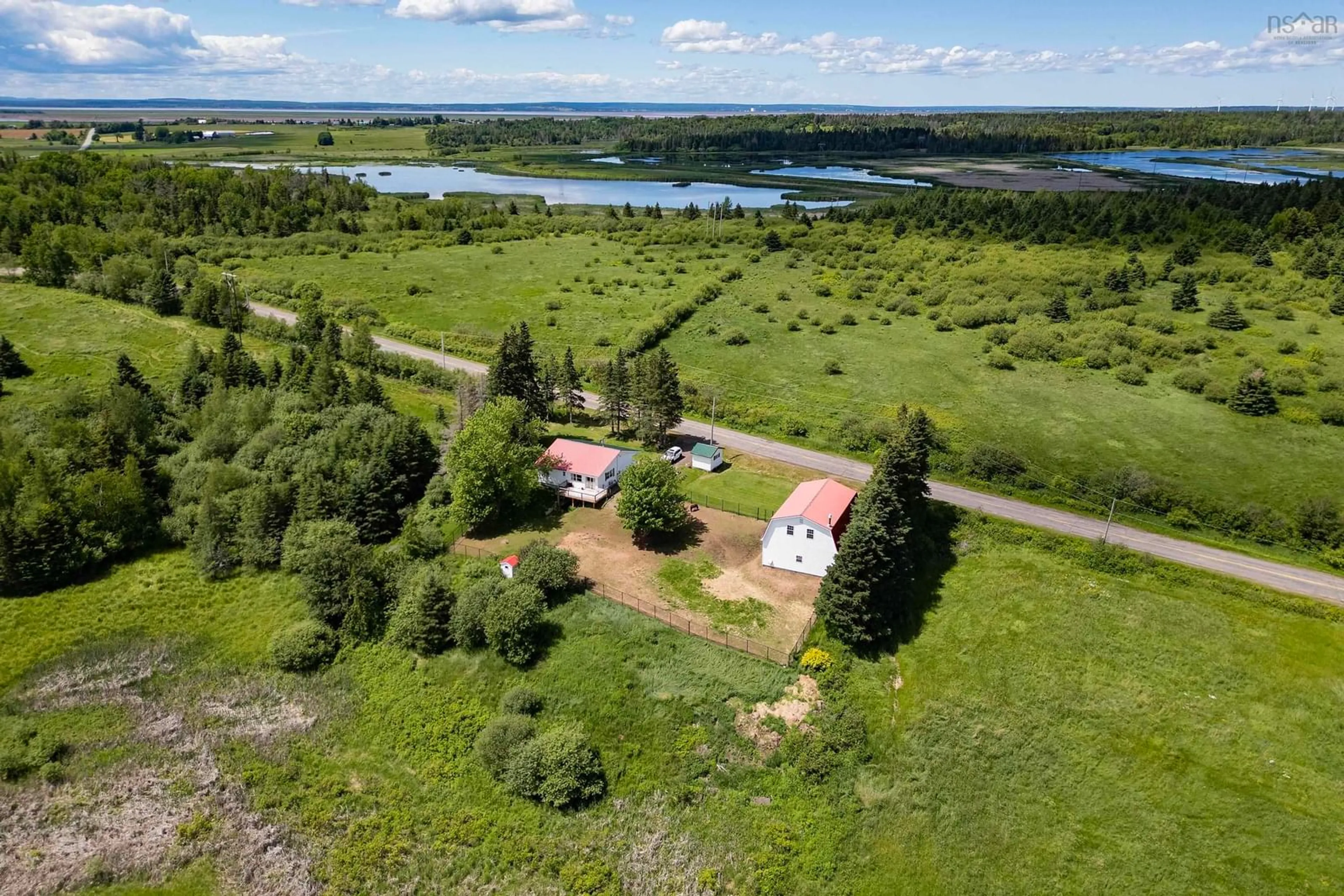 A pic from outside/outdoor area/front of a property/back of a property/a pic from drone, water/lake/river/ocean view for 144 Smith Rd, Nappan Nova Scotia B4H 3Y4