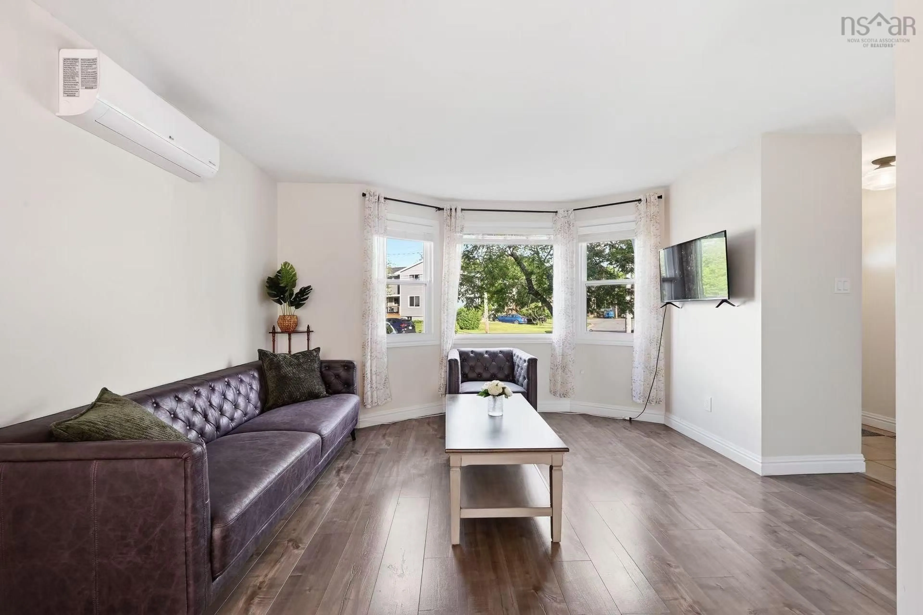 Living room with furniture, wood/laminate floor for 25 Dipper Crescent, Halifax Nova Scotia B3M 1W5