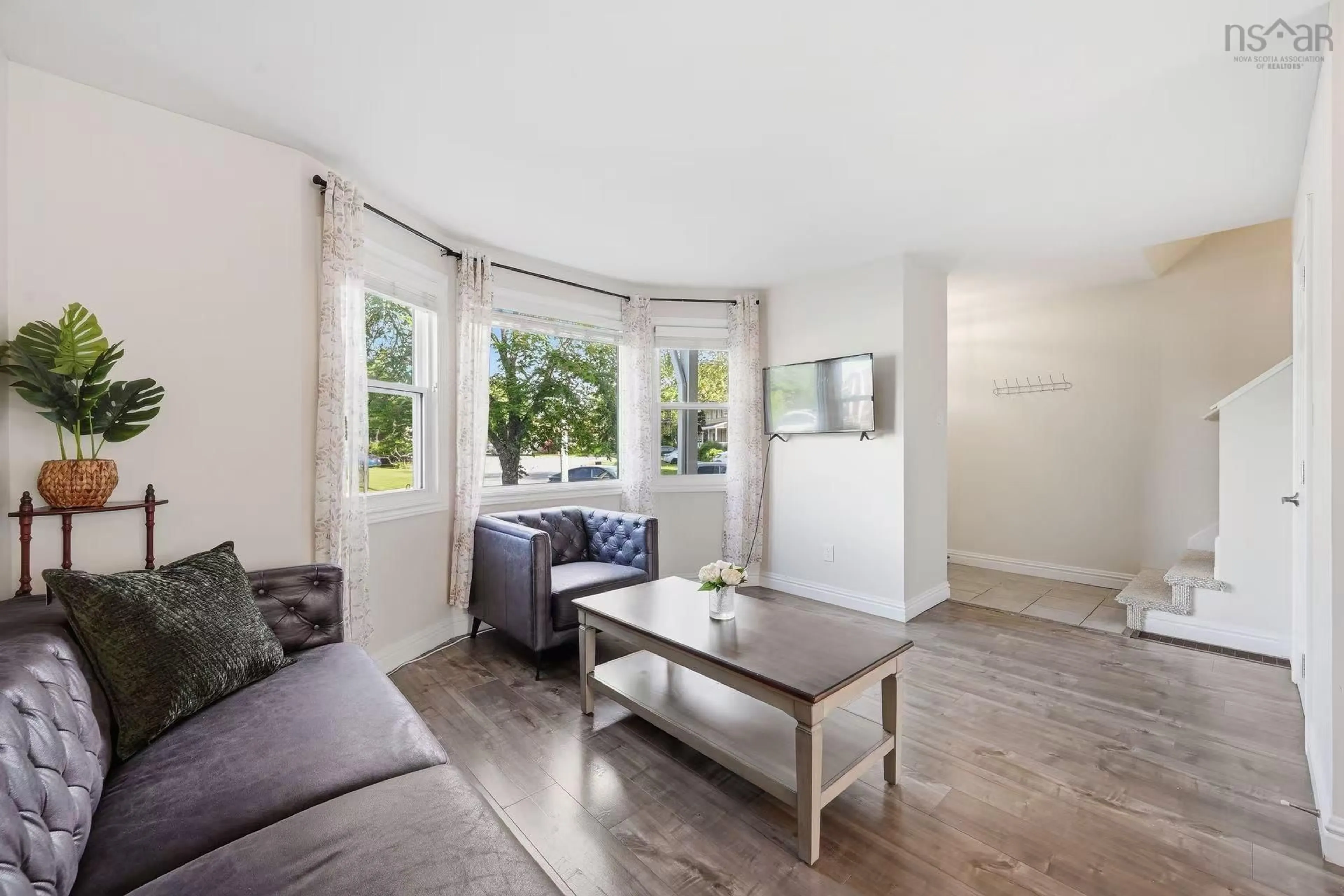 Living room with furniture, wood/laminate floor for 25 Dipper Crescent, Halifax Nova Scotia B3M 1W5