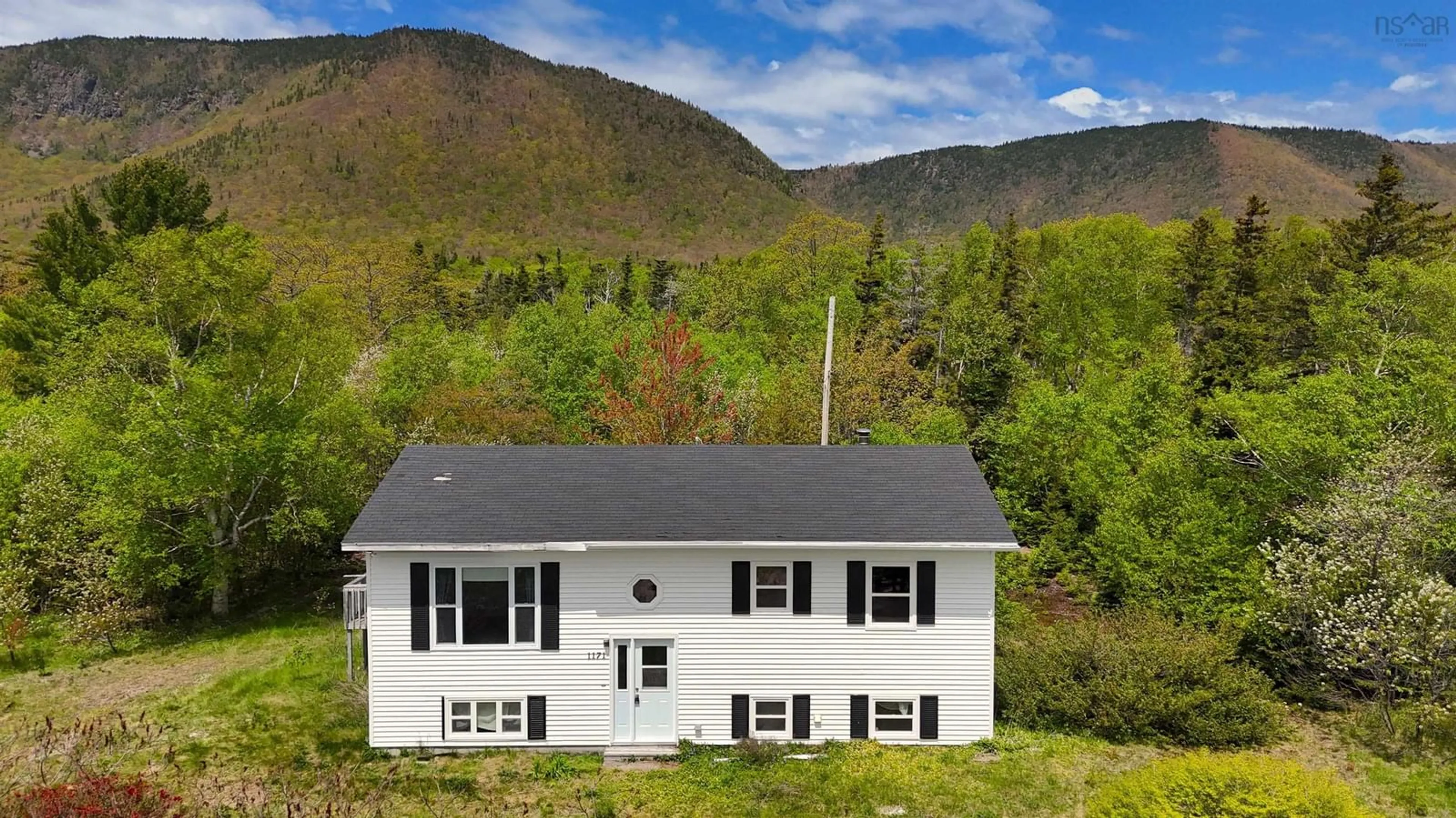 Home with vinyl exterior material, mountain view for 1171 Bay St Lawrence Road, Aspy Bay Nova Scotia B0C 1G0
