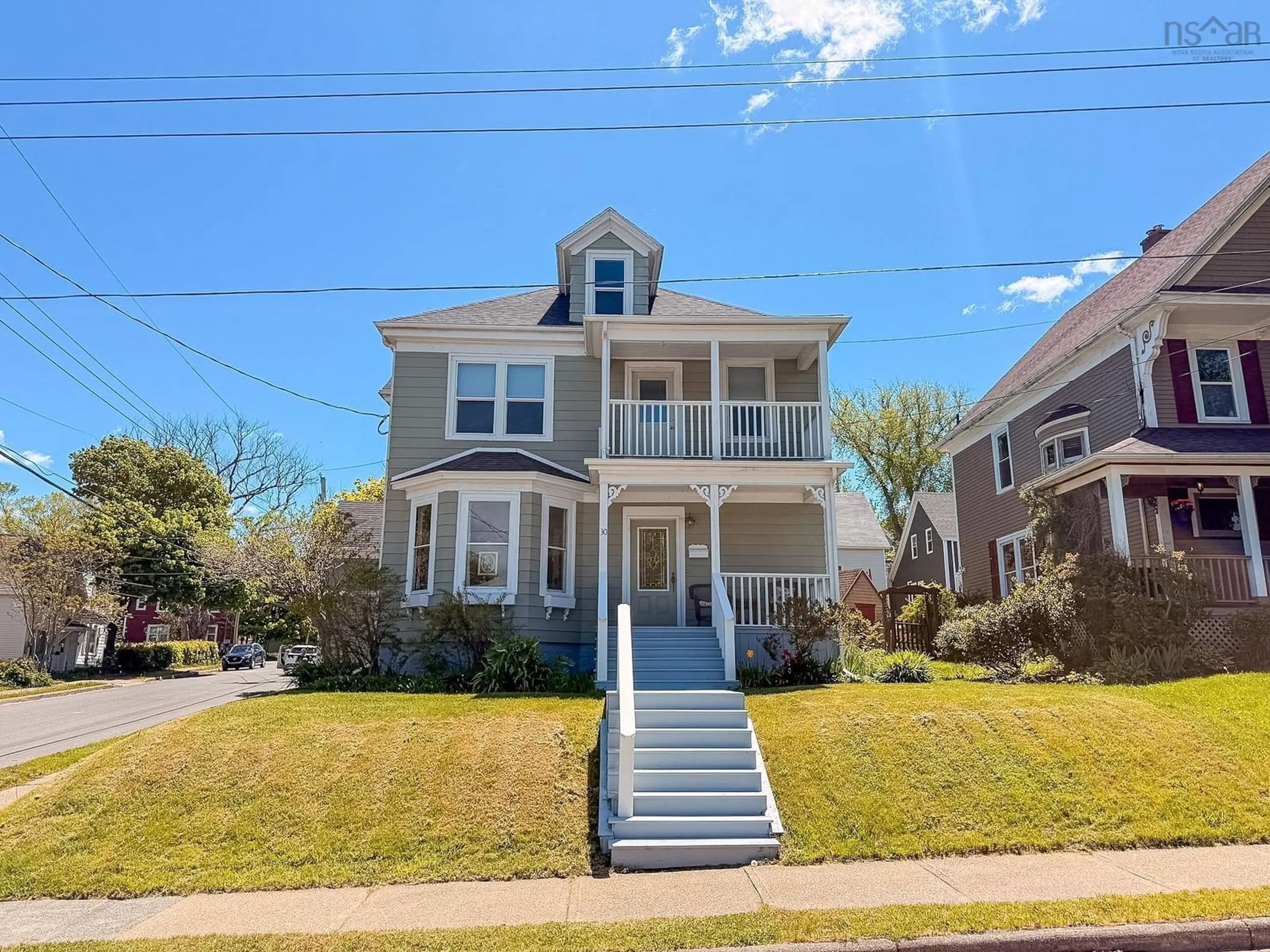 Home with vinyl exterior material, street for 30 Beacon St, Sydney Nova Scotia B1P 4S9