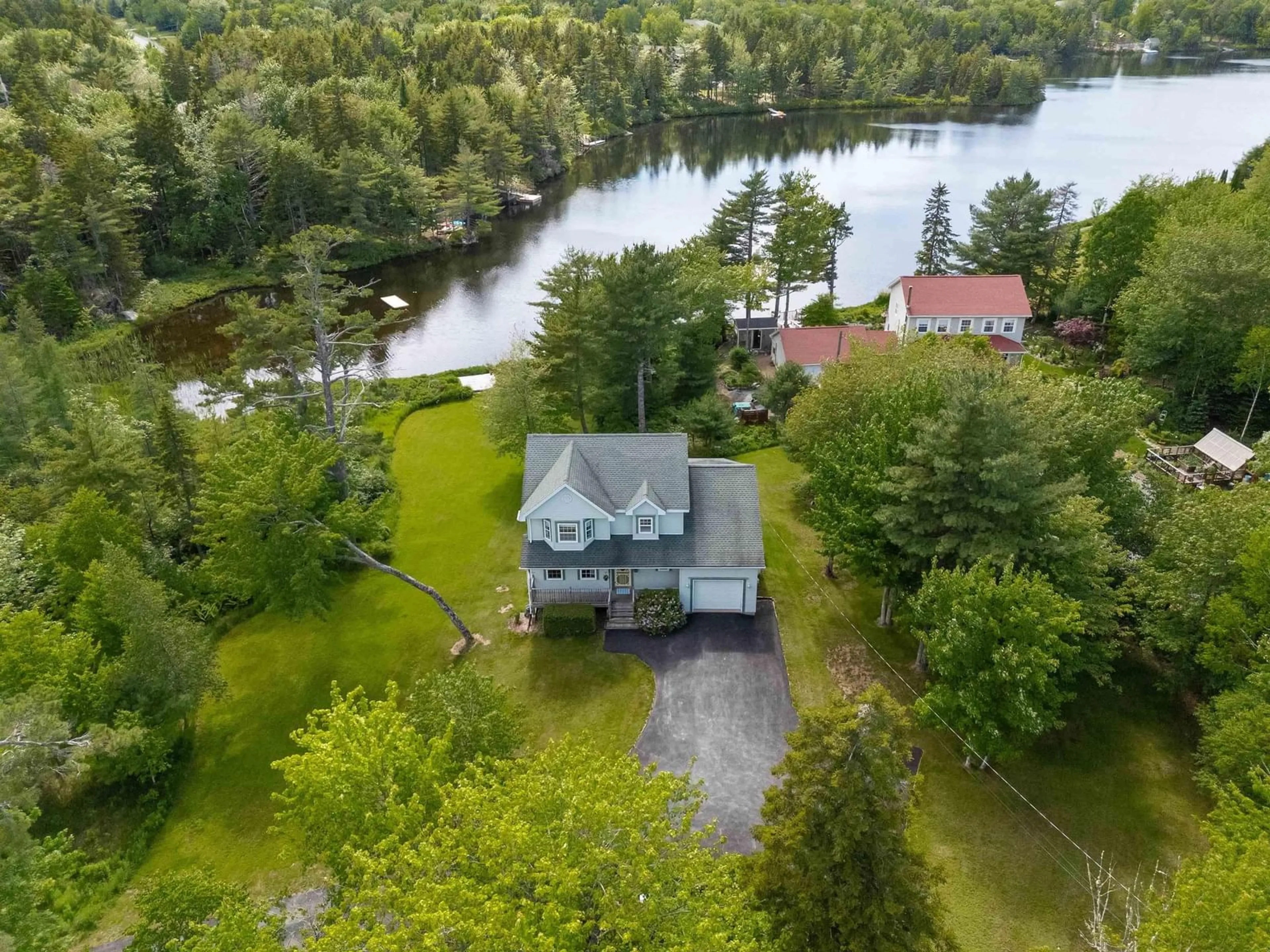 A pic from outside/outdoor area/front of a property/back of a property/a pic from drone, water/lake/river/ocean view for 111 St George Blvd, Hammonds Plains Nova Scotia B4B 1K7