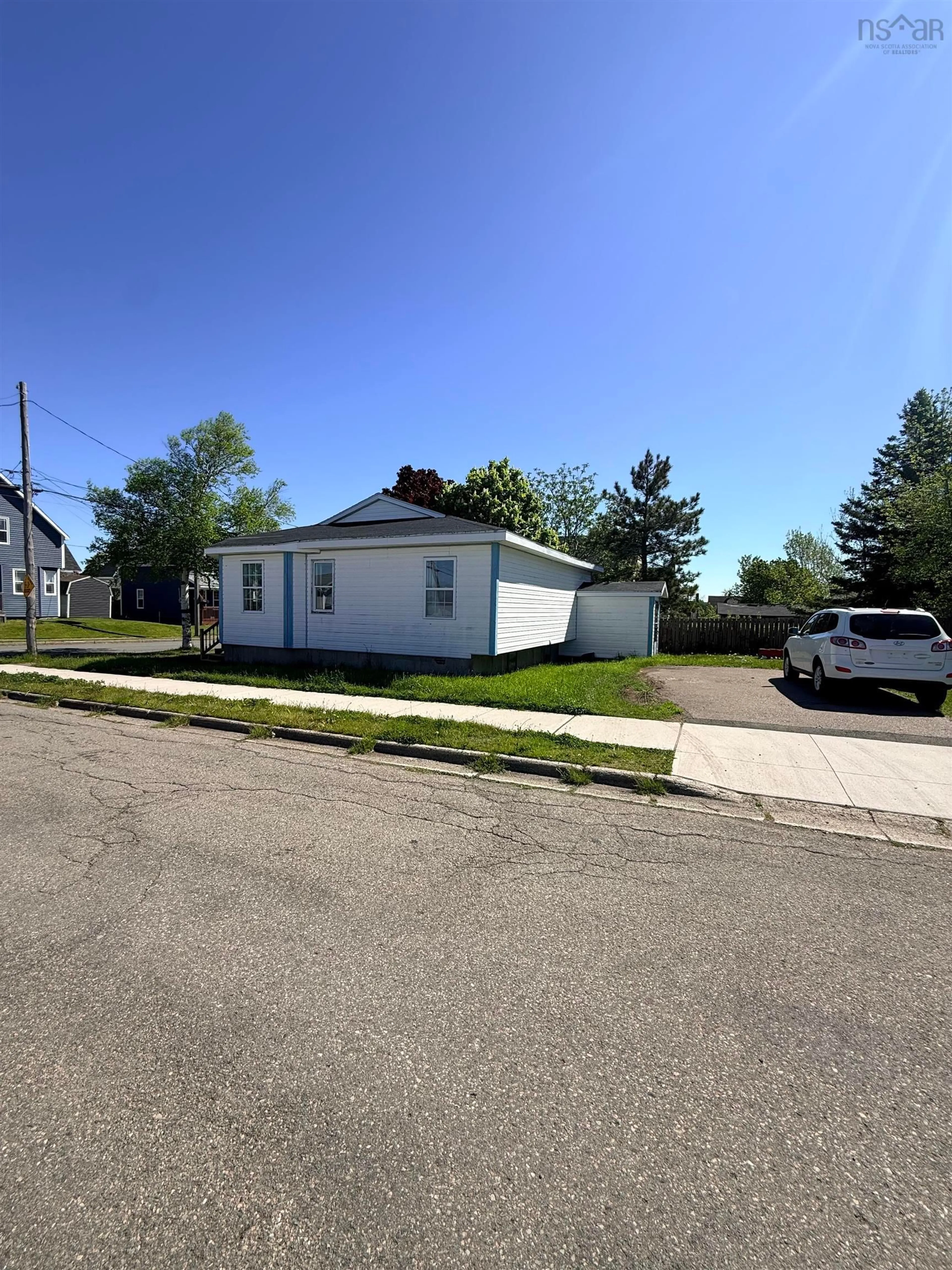 A pic from outside/outdoor area/front of a property/back of a property/a pic from drone, street for 100-102 Henry Street St #B1N2H3, Sydney Nova Scotia B1N 2H3