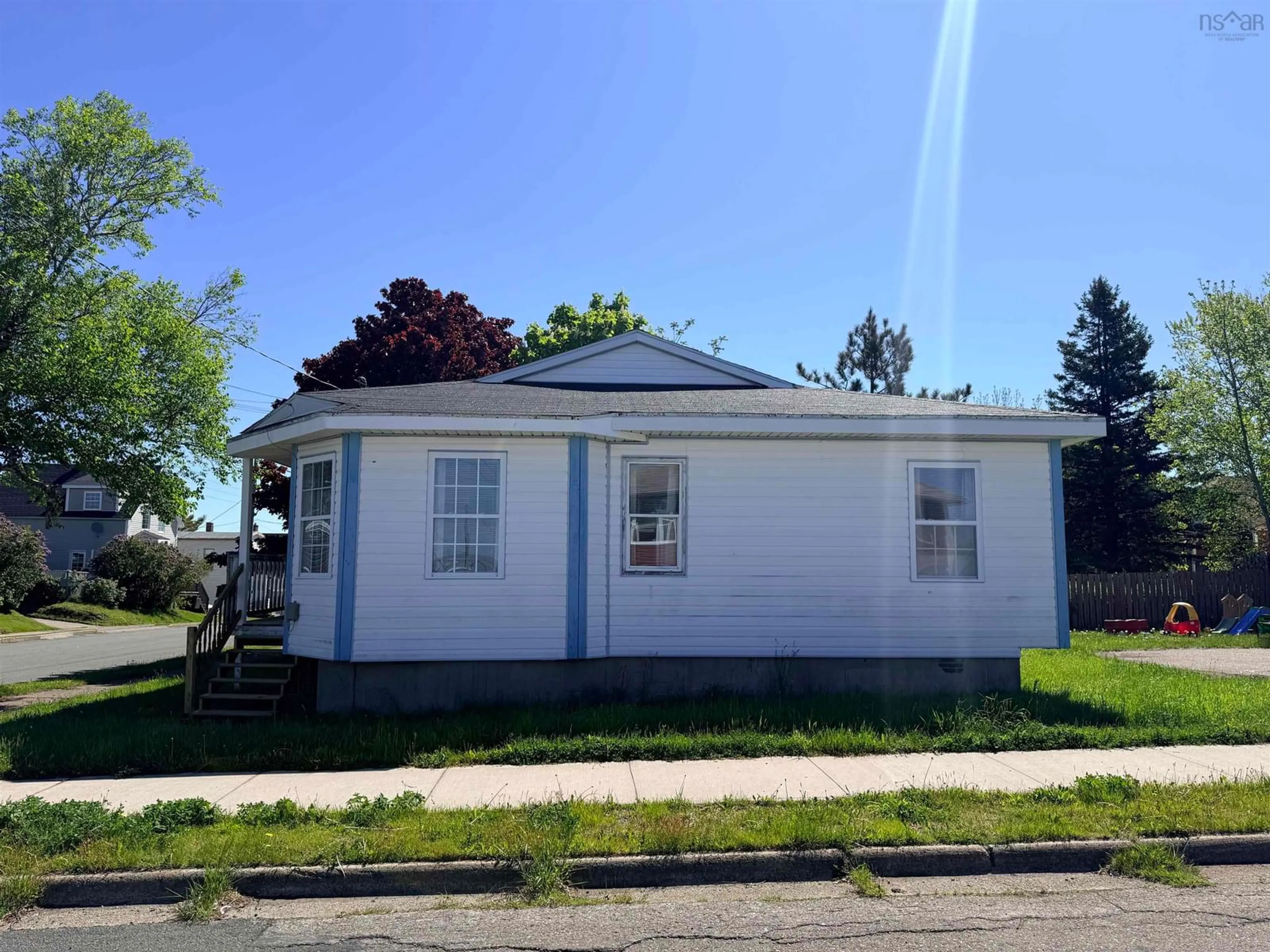 Home with vinyl exterior material, street for 100-102 Henry Street St #B1N2H3, Sydney Nova Scotia B1N 2H3