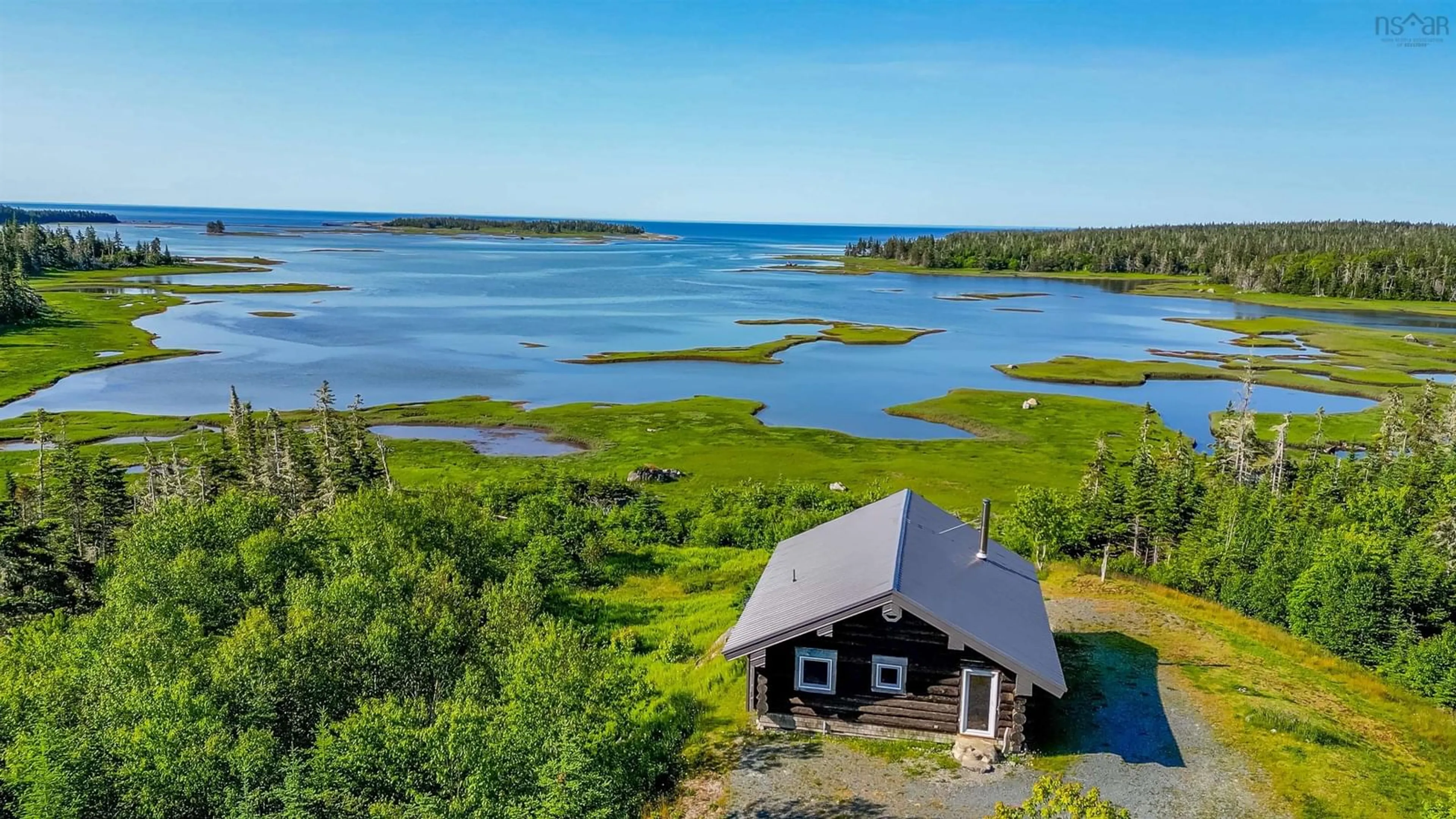 A pic from outside/outdoor area/front of a property/back of a property/a pic from drone, water/lake/river/ocean view for 2576 East Sable Rd, East Sable River Nova Scotia B0T 1V0