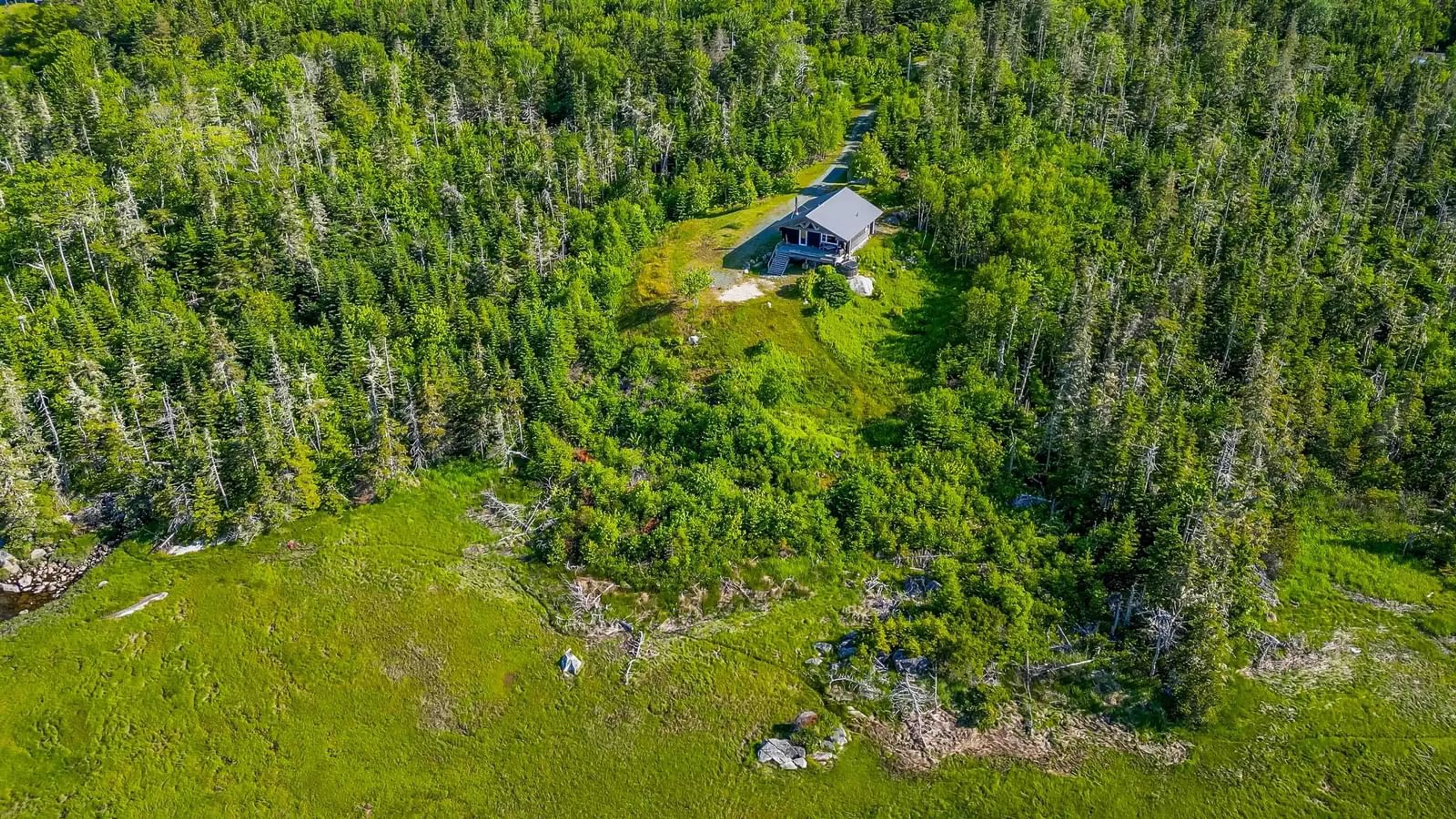 A pic from outside/outdoor area/front of a property/back of a property/a pic from drone, forest/trees view for 2576 East Sable Rd, East Sable River Nova Scotia B0T 1V0