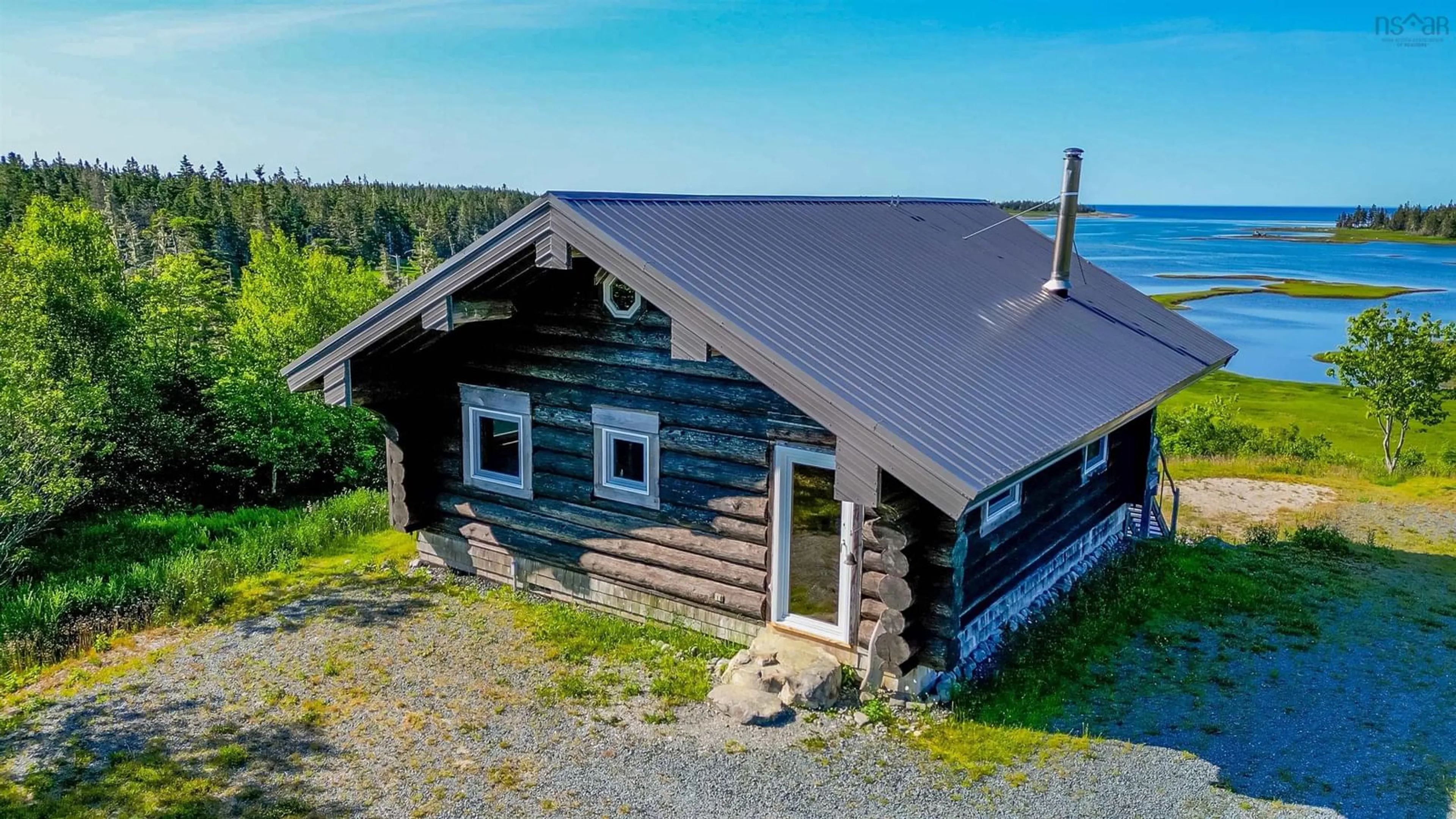 A pic from outside/outdoor area/front of a property/back of a property/a pic from drone, building for 2576 East Sable Rd, East Sable River Nova Scotia B0T 1V0