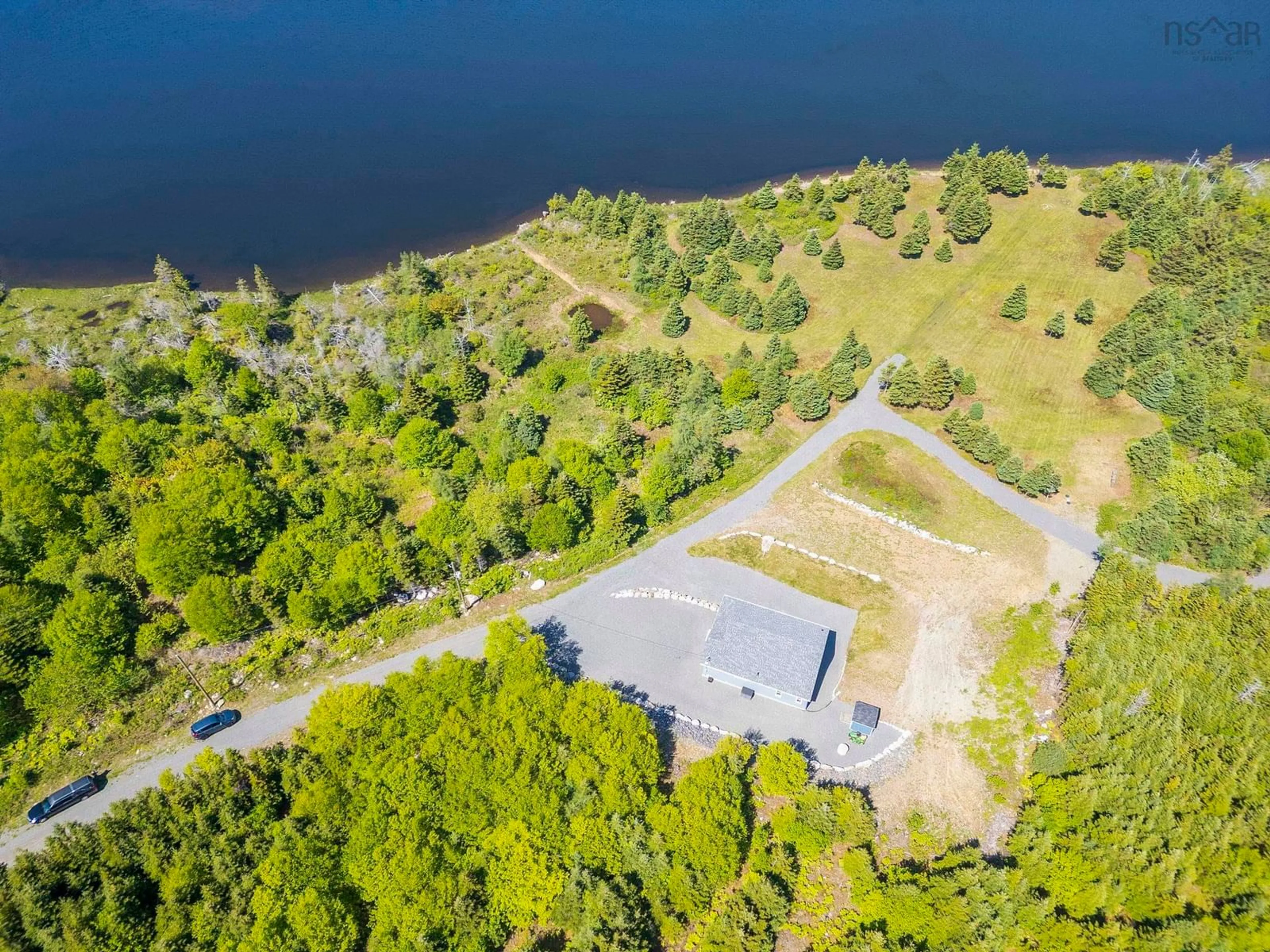 A pic from outside/outdoor area/front of a property/back of a property/a pic from drone, water/lake/river/ocean view for 9118 316 Hwy, New Harbour Nova Scotia B0H 1T0
