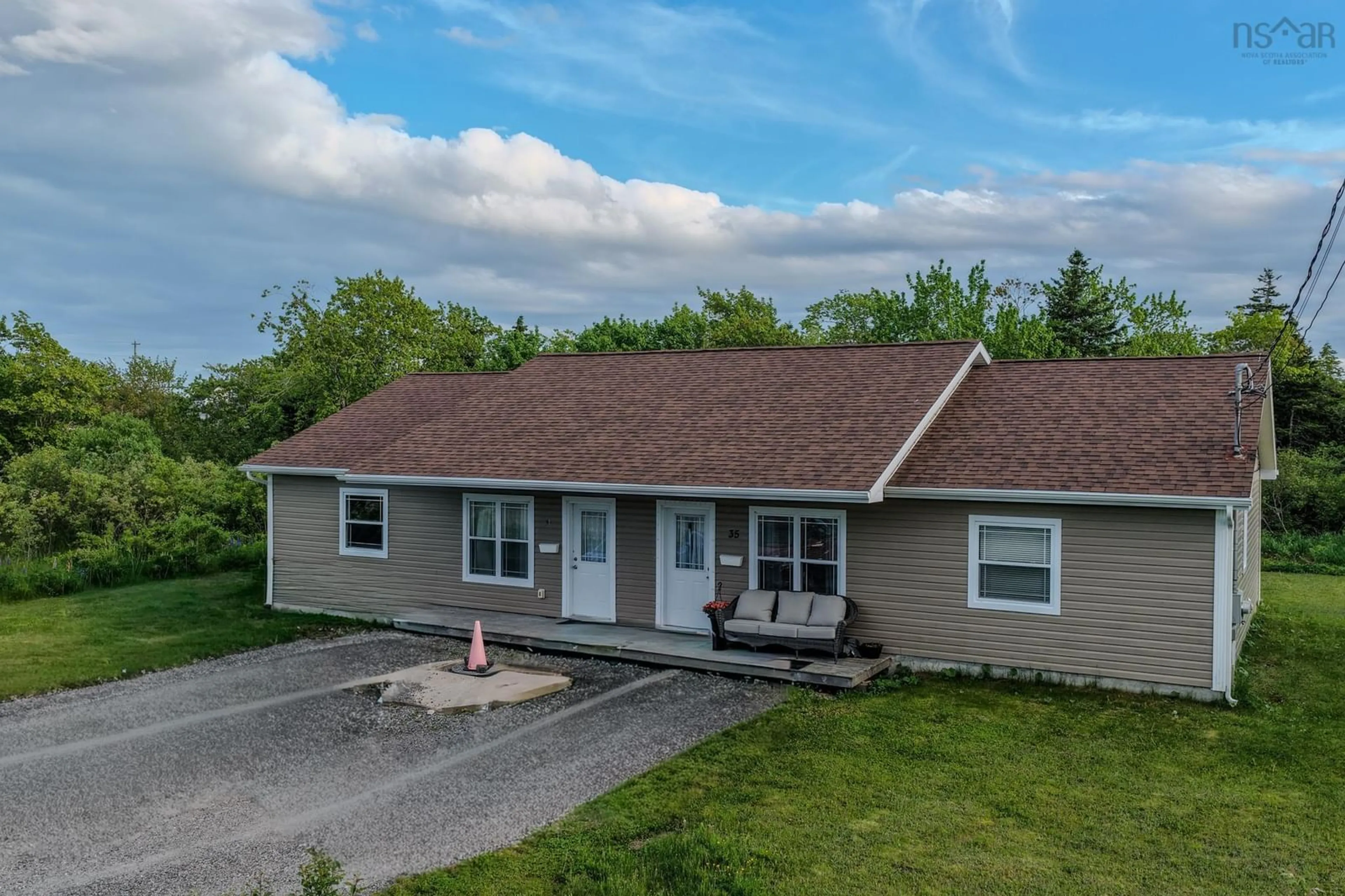 A pic from outside/outdoor area/front of a property/back of a property/a pic from drone, street for 33 Deerfield Dr, Coxheath Nova Scotia B1R 2K4