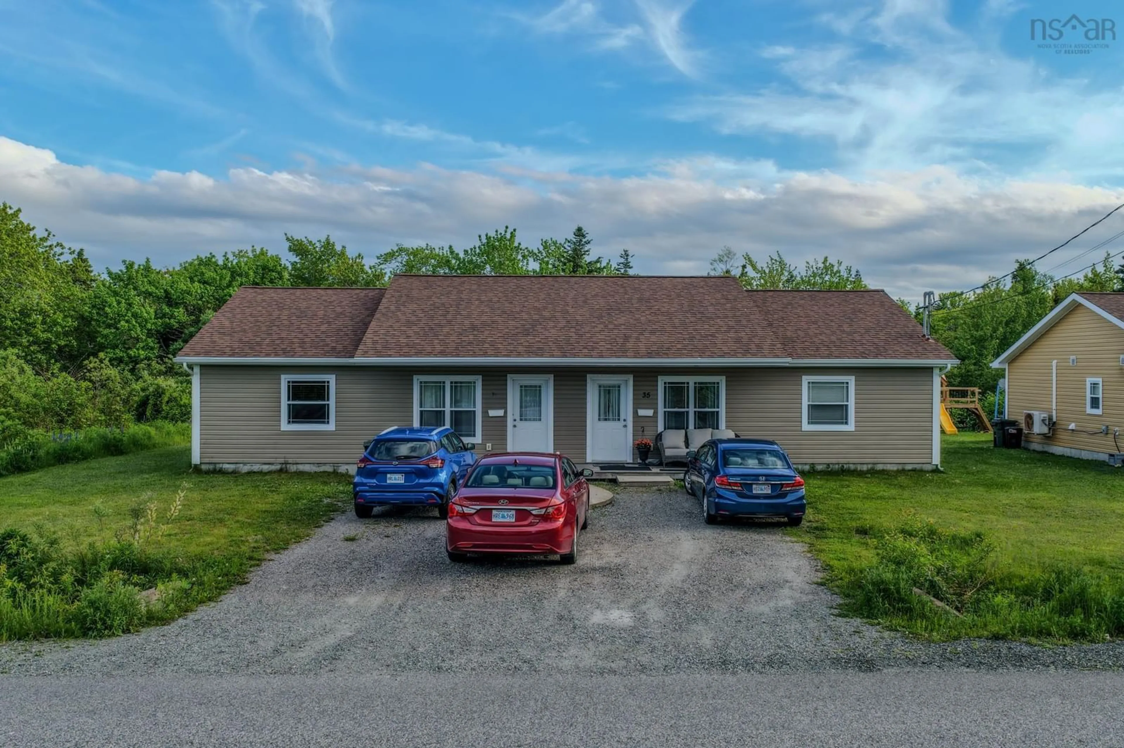 A pic from outside/outdoor area/front of a property/back of a property/a pic from drone, street for 33 Deerfield Dr, Coxheath Nova Scotia B1R 2K4