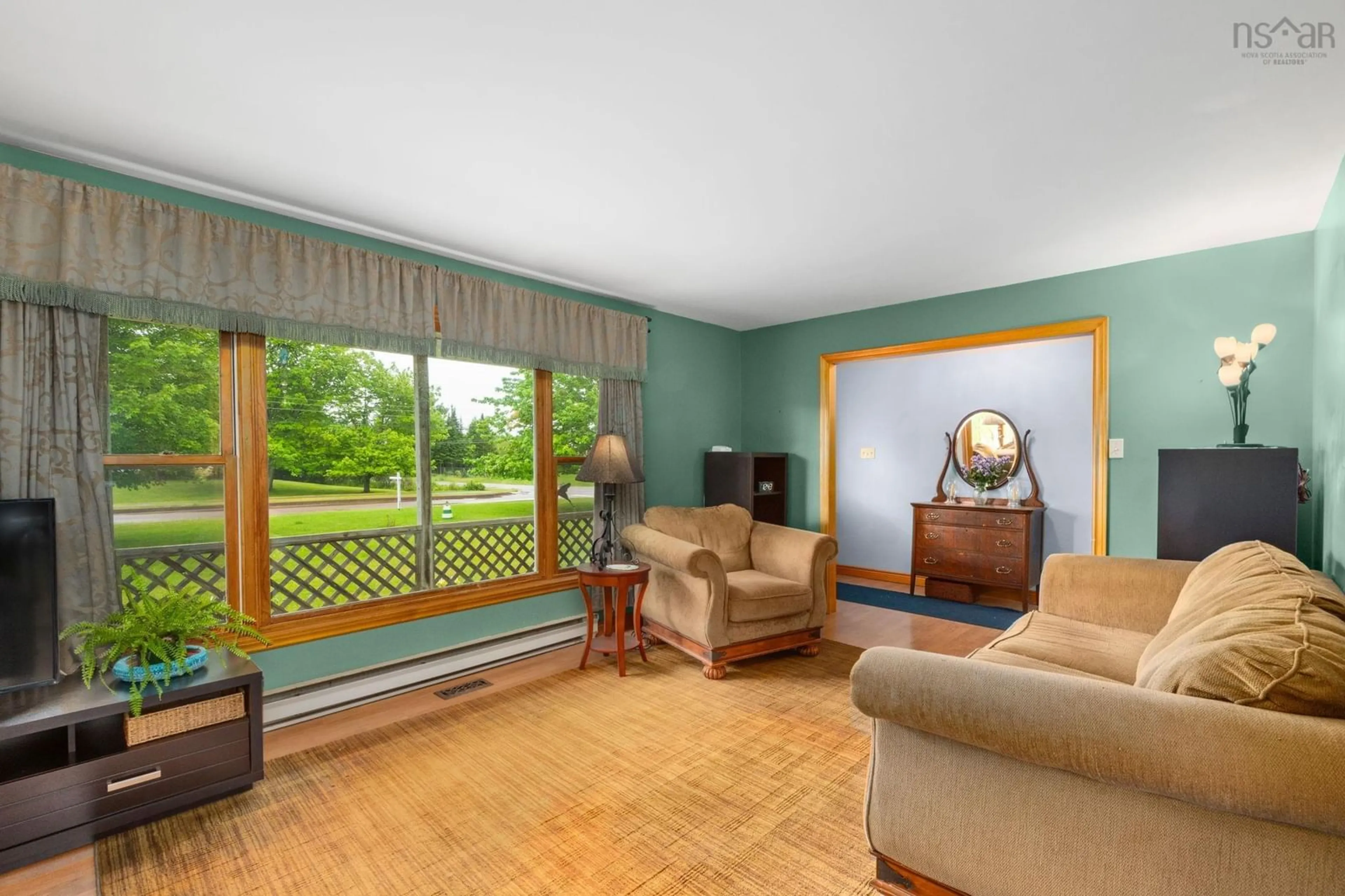 Living room with furniture, wood/laminate floor for 91 Meadowland Ave, Bible Hill Nova Scotia B2N 6J9
