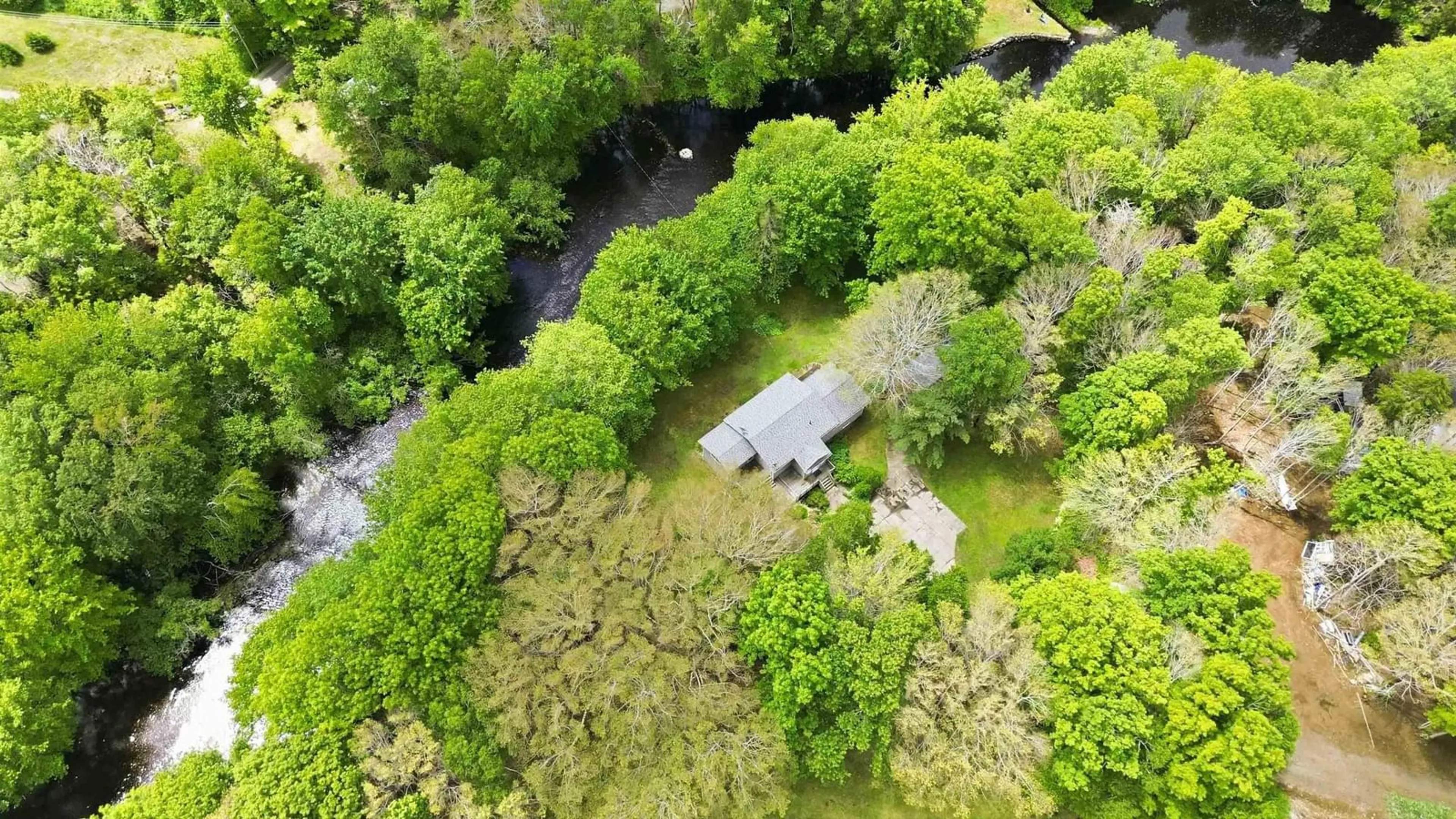 A pic from outside/outdoor area/front of a property/back of a property/a pic from drone, forest/trees view for 550 Allee Des Black, Bangor Nova Scotia B0W 2L0