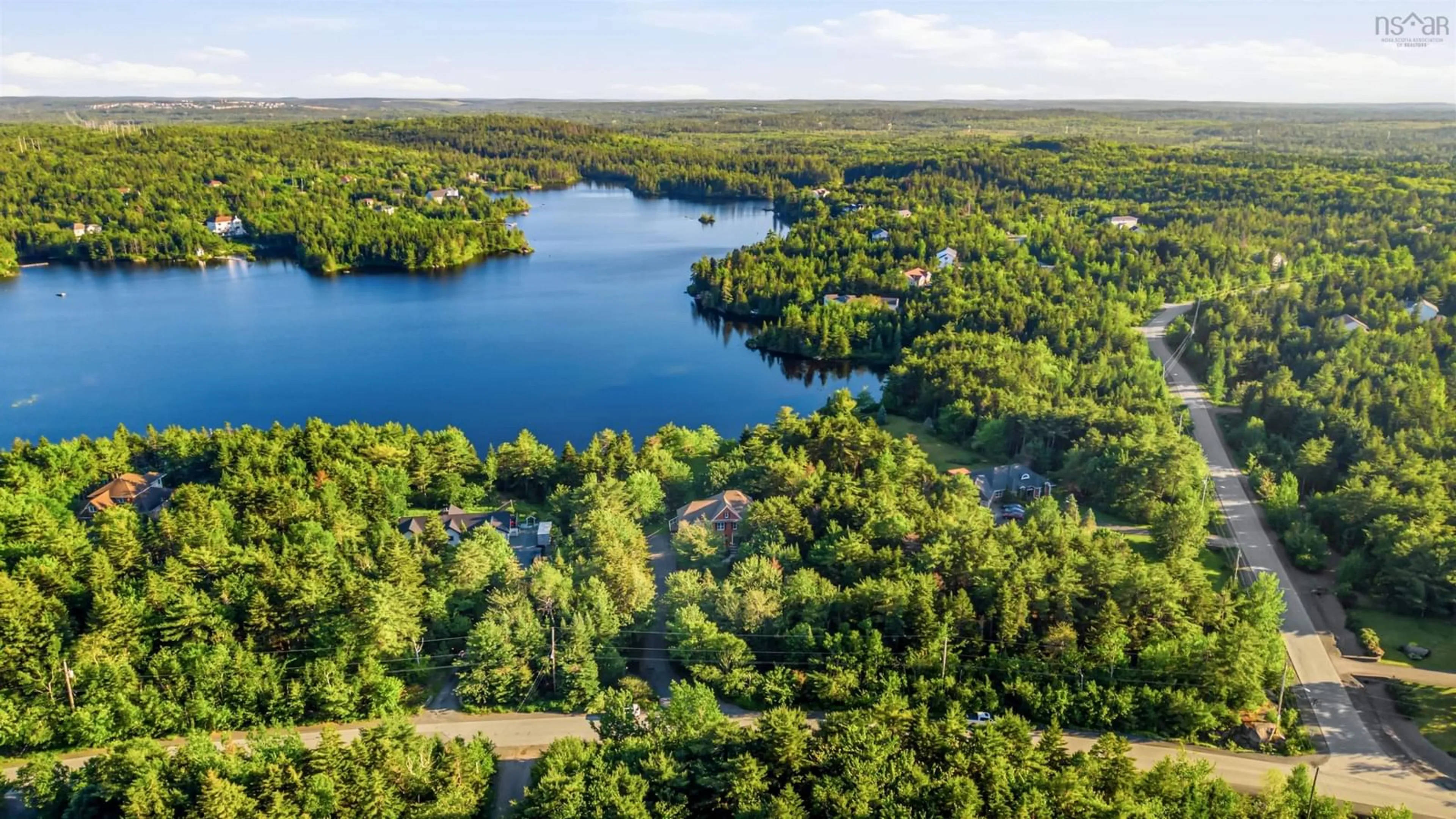 A pic from outside/outdoor area/front of a property/back of a property/a pic from drone, water/lake/river/ocean view for 105 Lakeshore Dr, Hammonds Plains Nova Scotia B4B 1X1