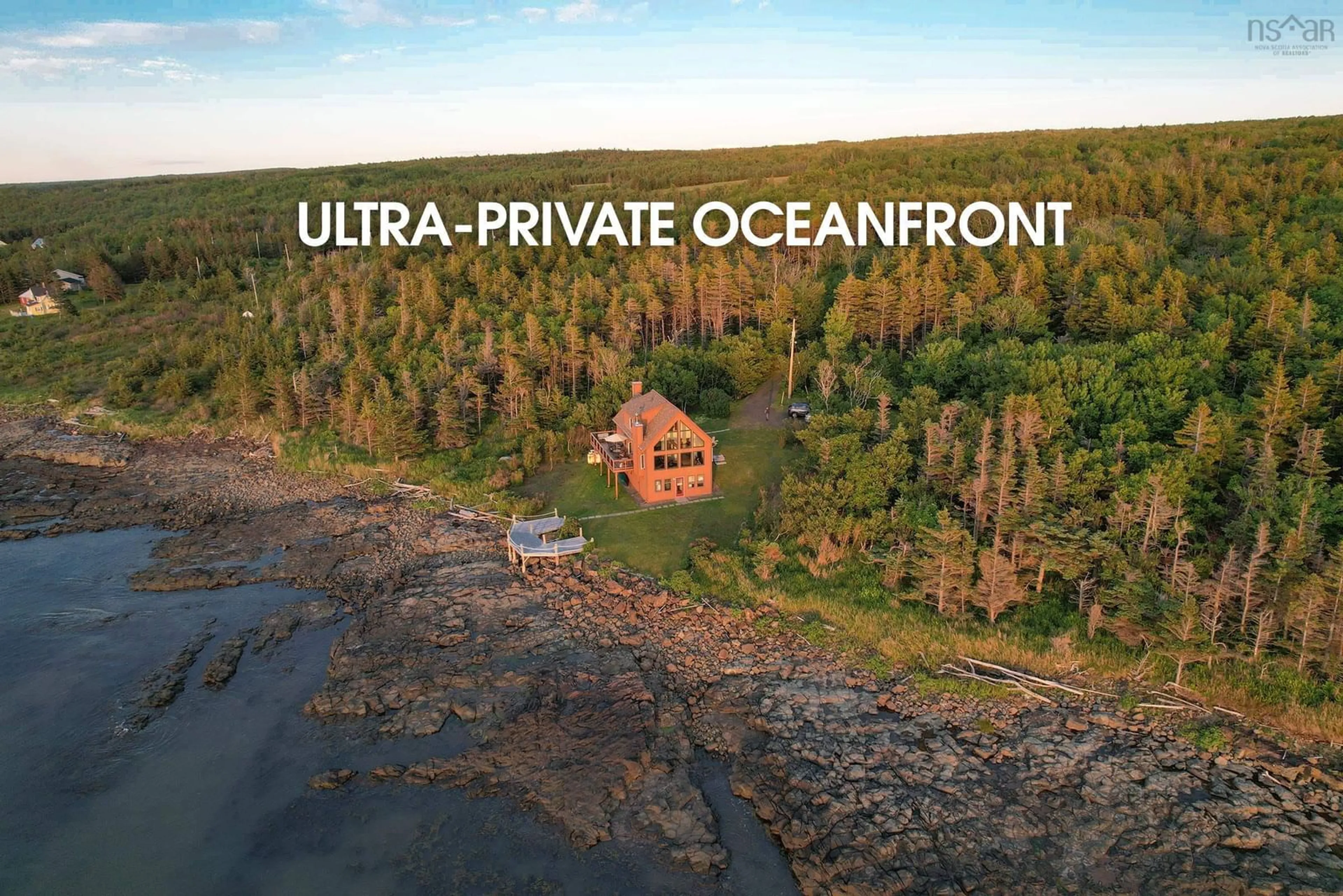 A pic from outside/outdoor area/front of a property/back of a property/a pic from drone, water/lake/river/ocean view for 6671 Shore Rd, Youngs Cove Nova Scotia B0S 1L0