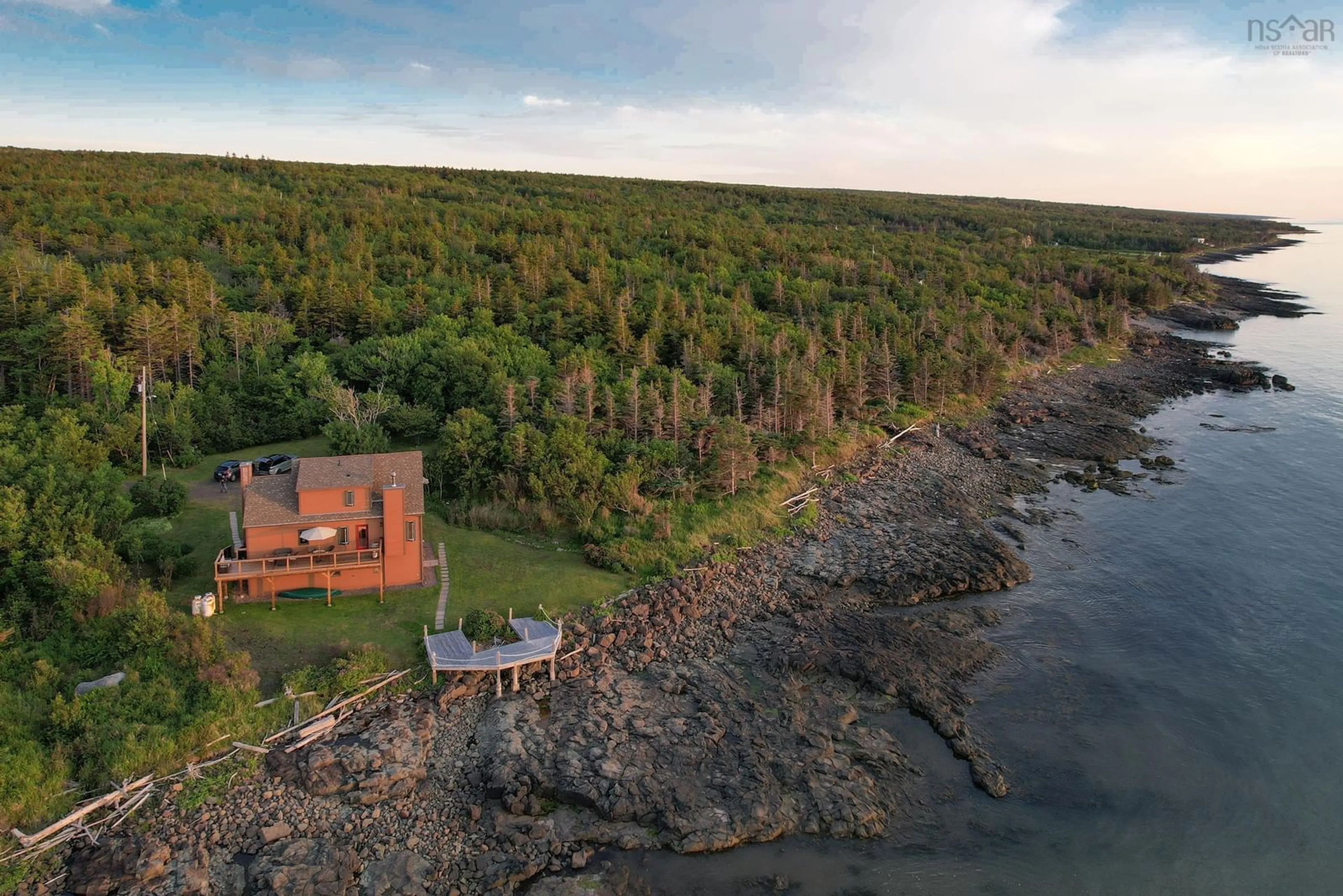A pic from outside/outdoor area/front of a property/back of a property/a pic from drone, water/lake/river/ocean view for 6671 Shore Rd, Youngs Cove Nova Scotia B0S 1L0