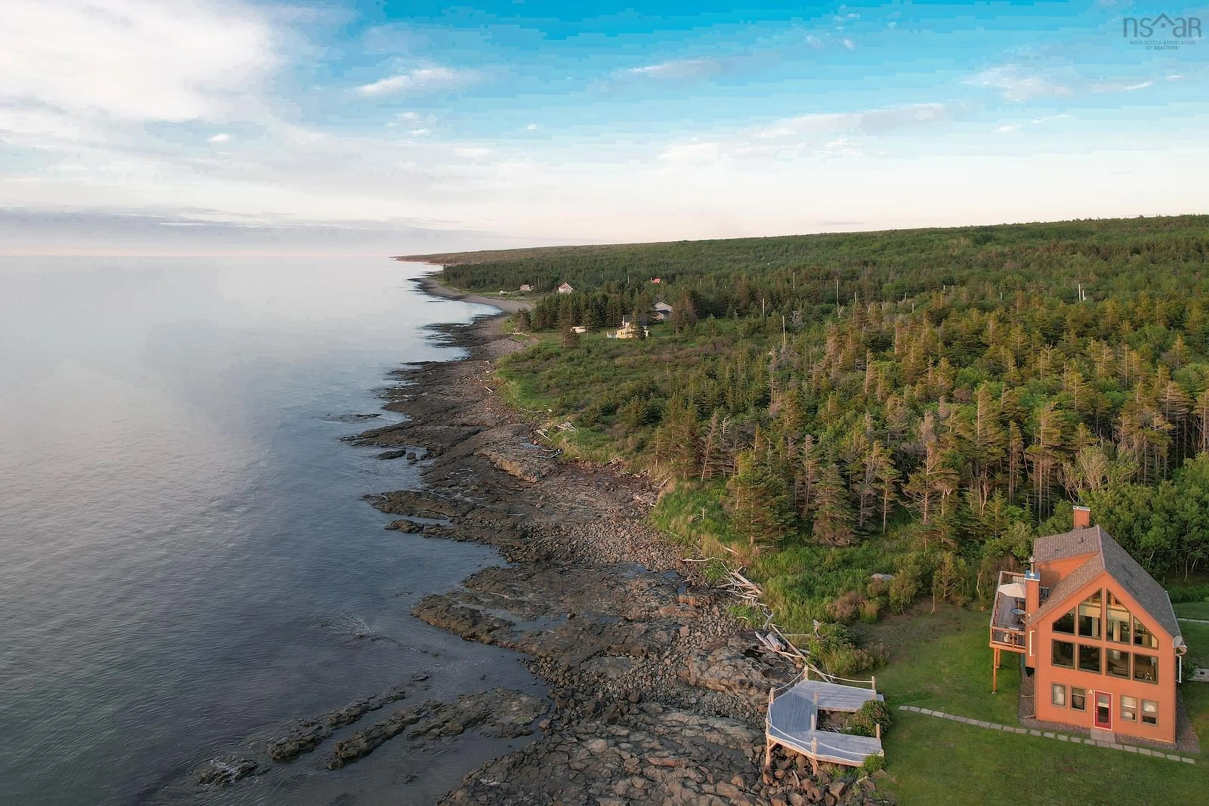 A pic from outside/outdoor area/front of a property/back of a property/a pic from drone, water/lake/river/ocean view for 6671 Shore Rd, Youngs Cove Nova Scotia B0S 1L0