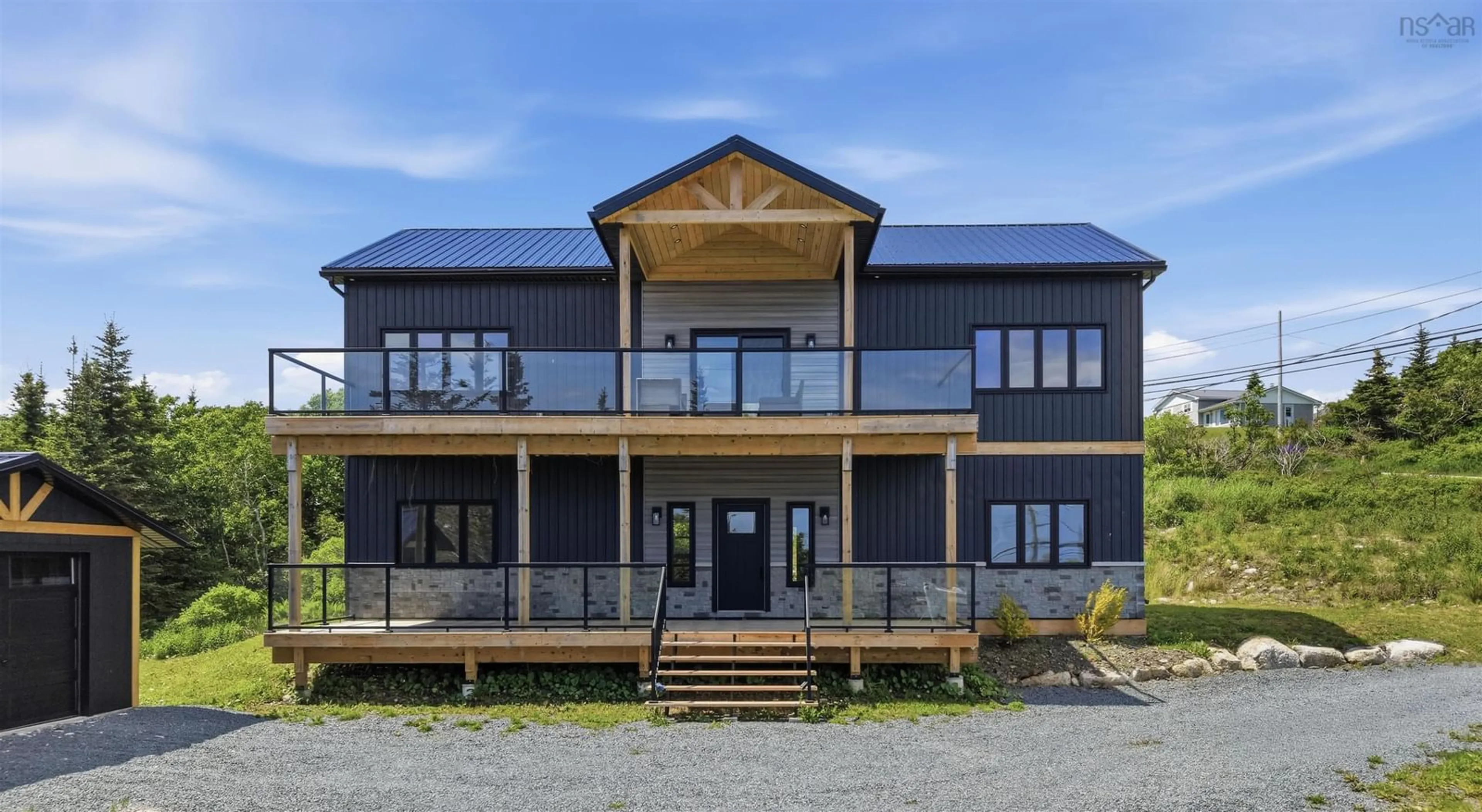 A pic from outside/outdoor area/front of a property/back of a property/a pic from drone, building for 1605 Terence Bay Rd, Terence Bay Nova Scotia B3T 1X9