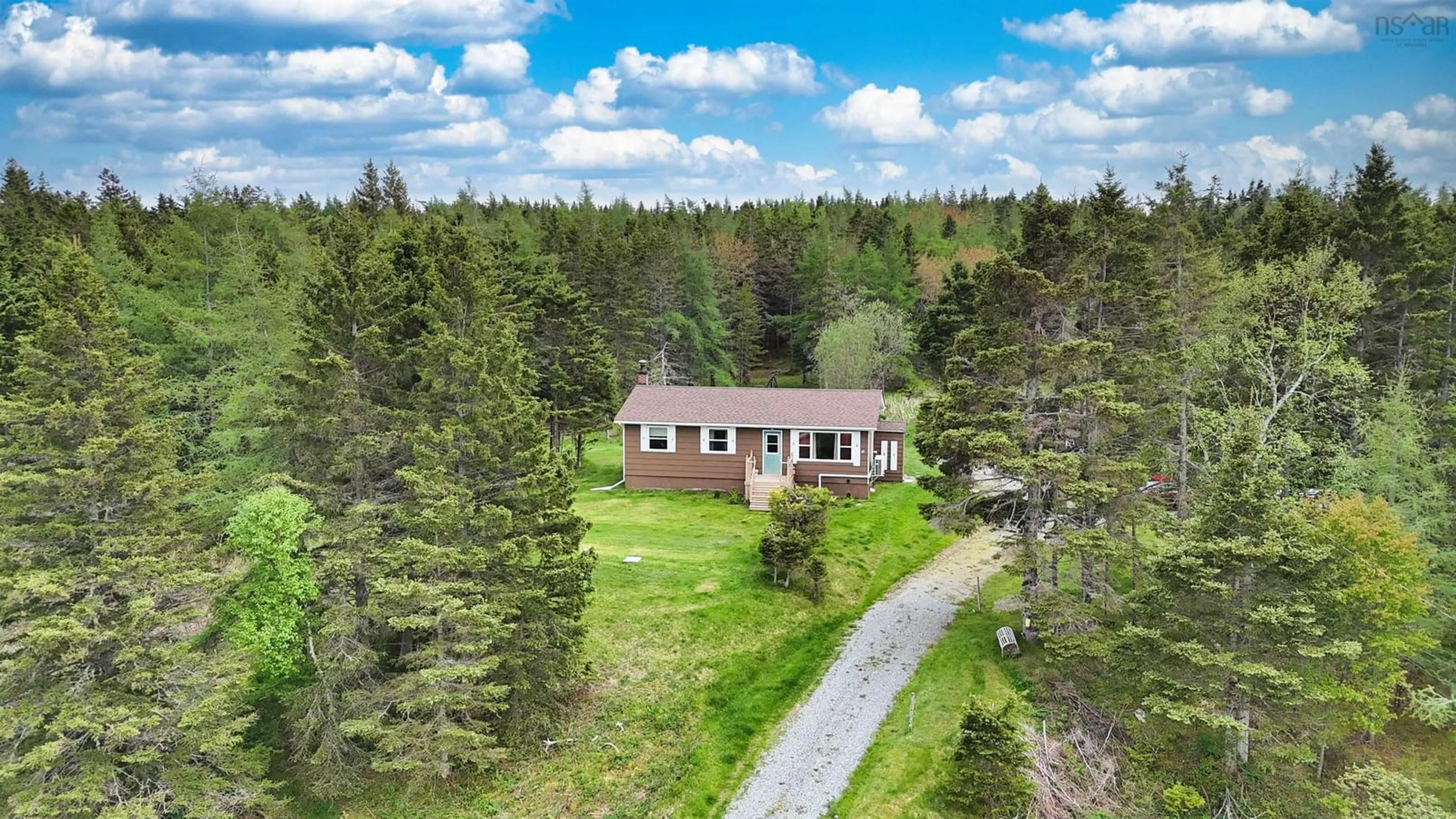 A pic from outside/outdoor area/front of a property/back of a property/a pic from drone, unknown for 84 South Side River Bourgeois Rd, River Bourgeois Nova Scotia B0E 2X0
