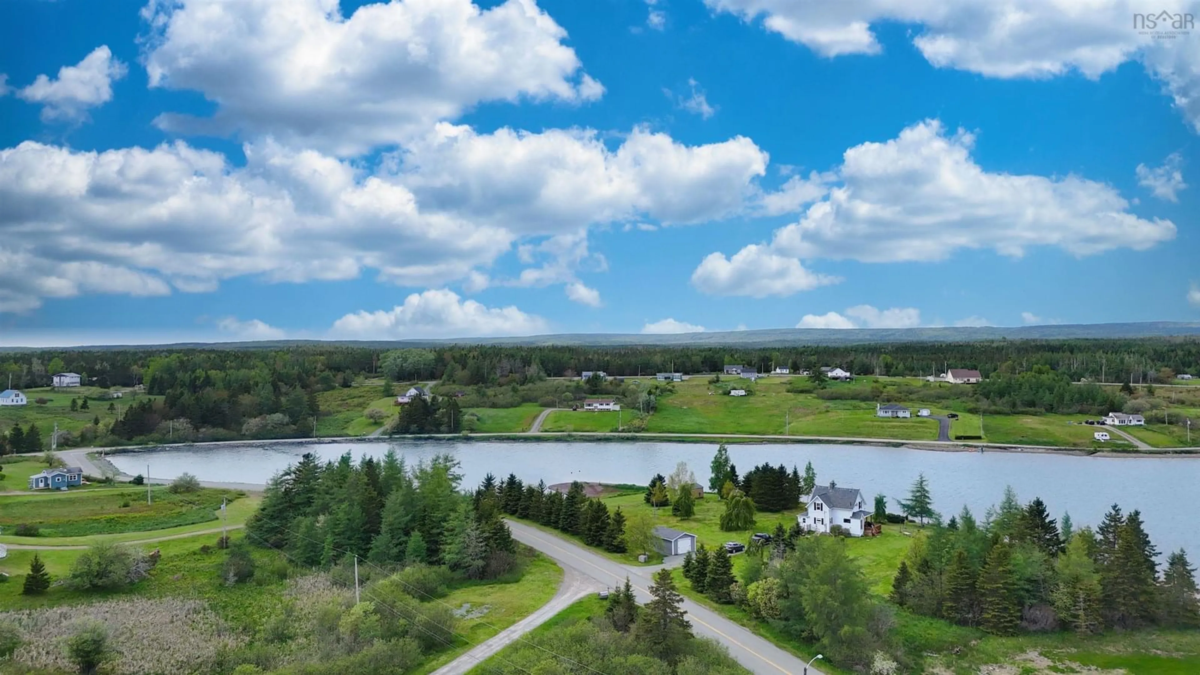 A pic from outside/outdoor area/front of a property/back of a property/a pic from drone, water/lake/river/ocean view for 84 South Side River Bourgeois Rd, River Bourgeois Nova Scotia B0E 2X0