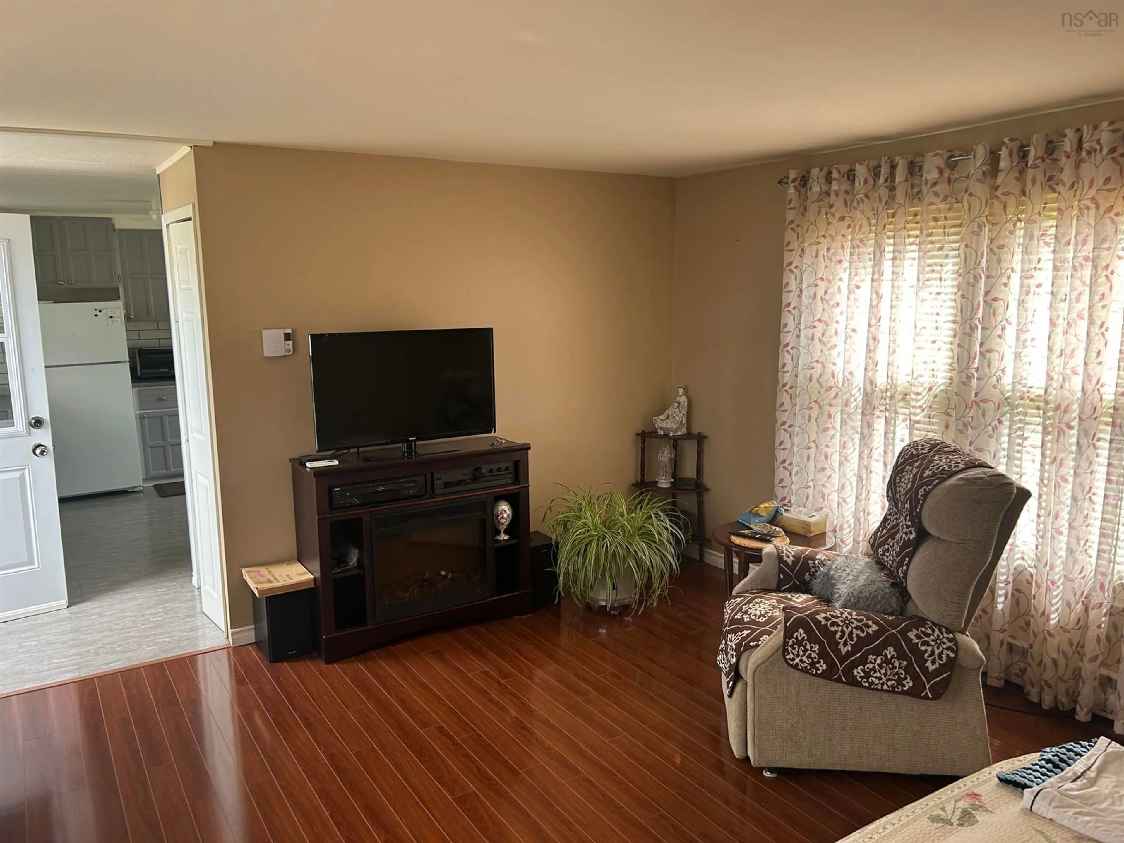 Living room with furniture, wood/laminate floor for 128 Second St, Howie Centre Nova Scotia B1L 1C9
