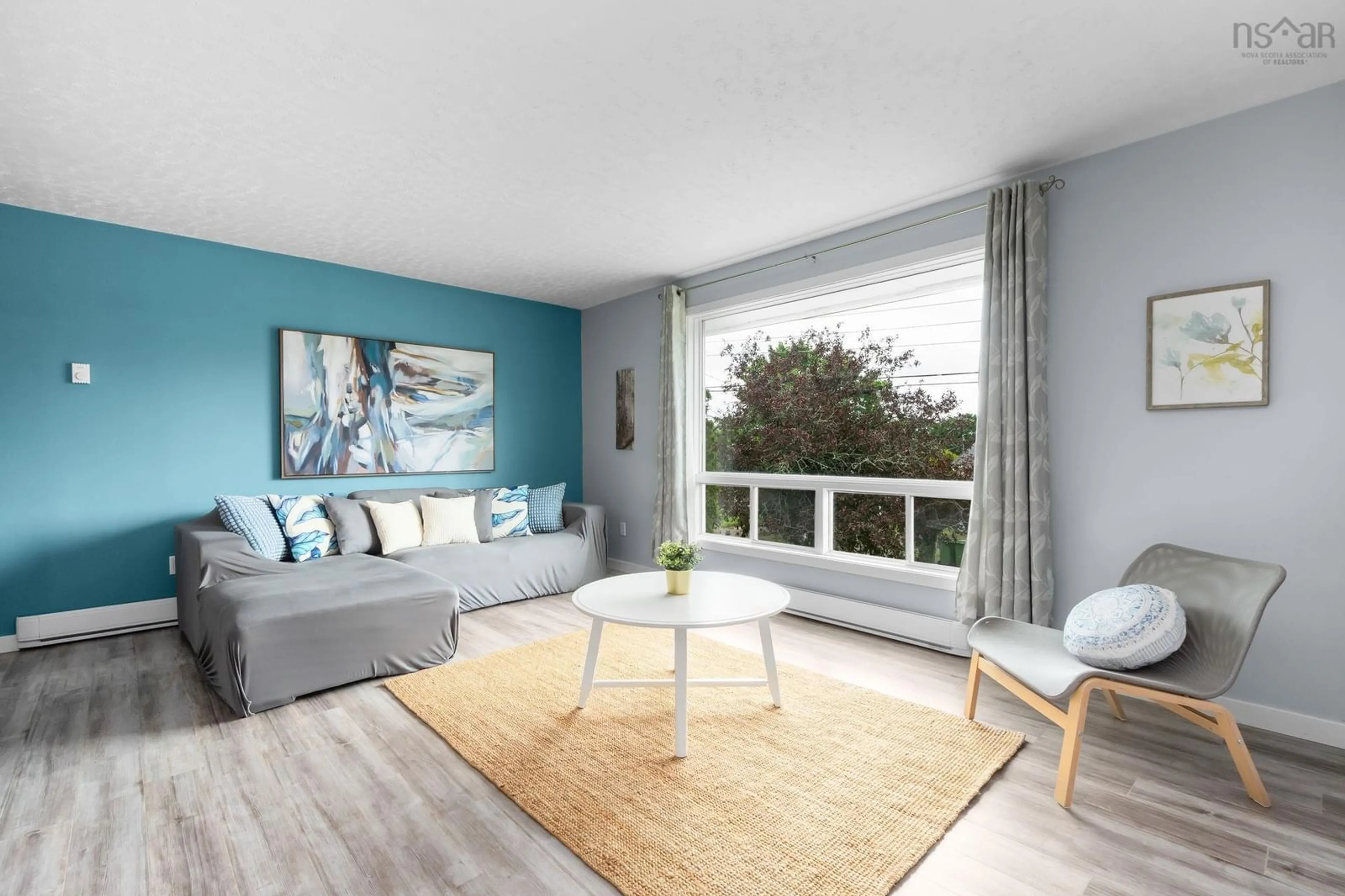 Living room with furniture, wood/laminate floor for 1023 Marie Cres #1021, Kentville Nova Scotia B4N 1X2