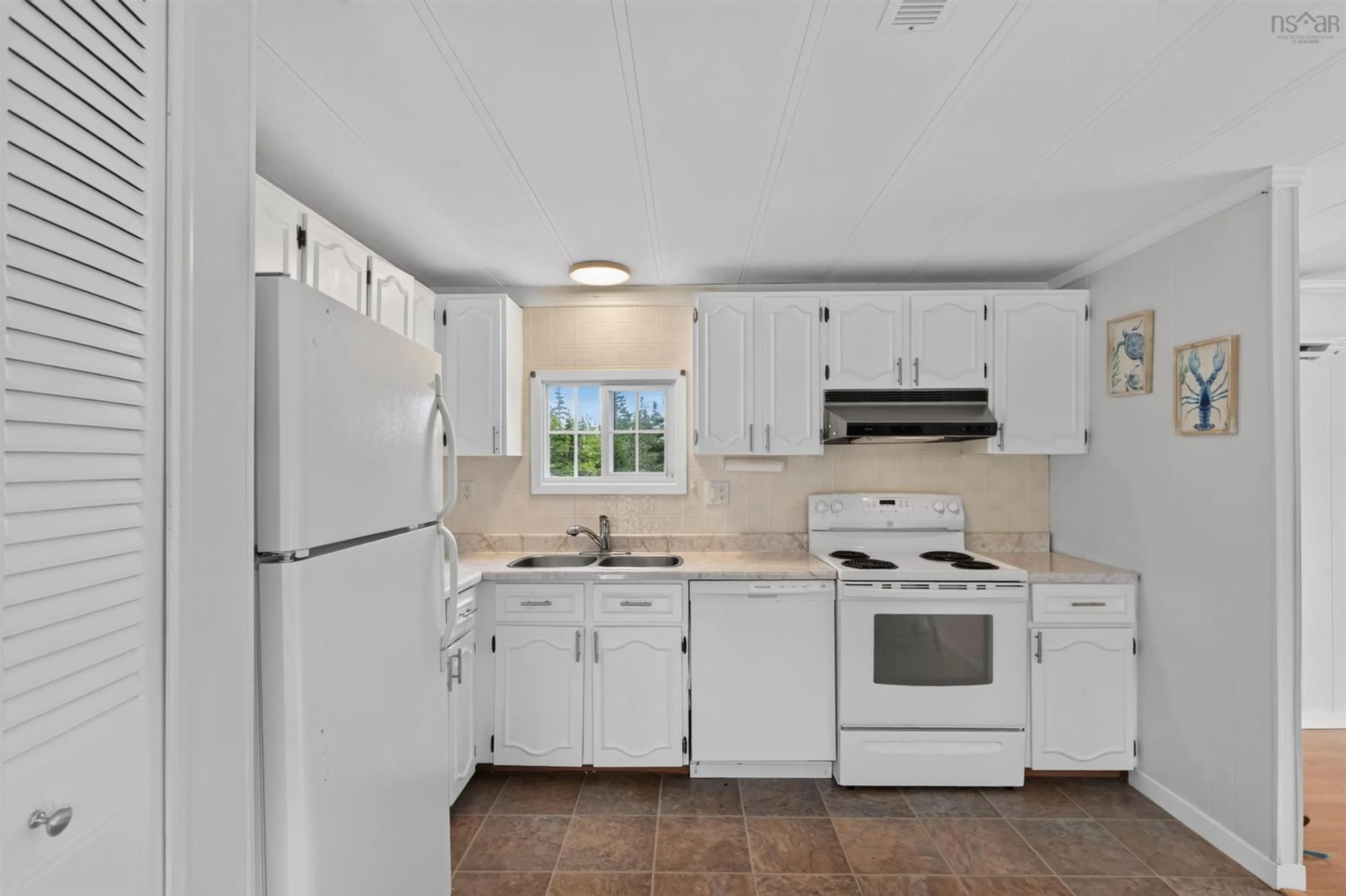 Standard kitchen, ceramic/tile floor for 3267 Clam Harbour Rd, Clam Harbour Nova Scotia B0J 1Y0