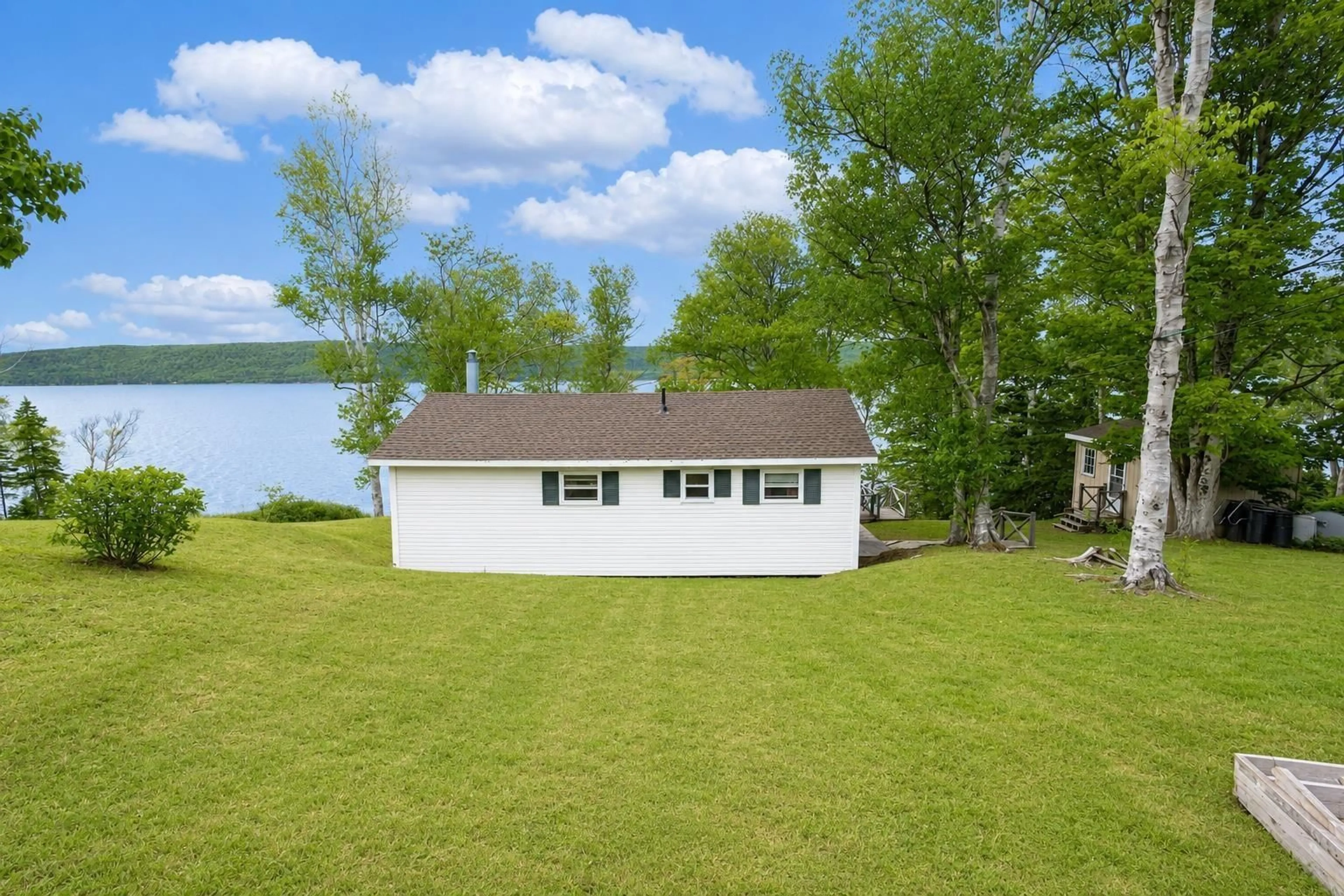 A pic from outside/outdoor area/front of a property/back of a property/a pic from drone, water/lake/river/ocean view for 5636 East Bay Hwy, Ben Eoin Nova Scotia B0E 3B0