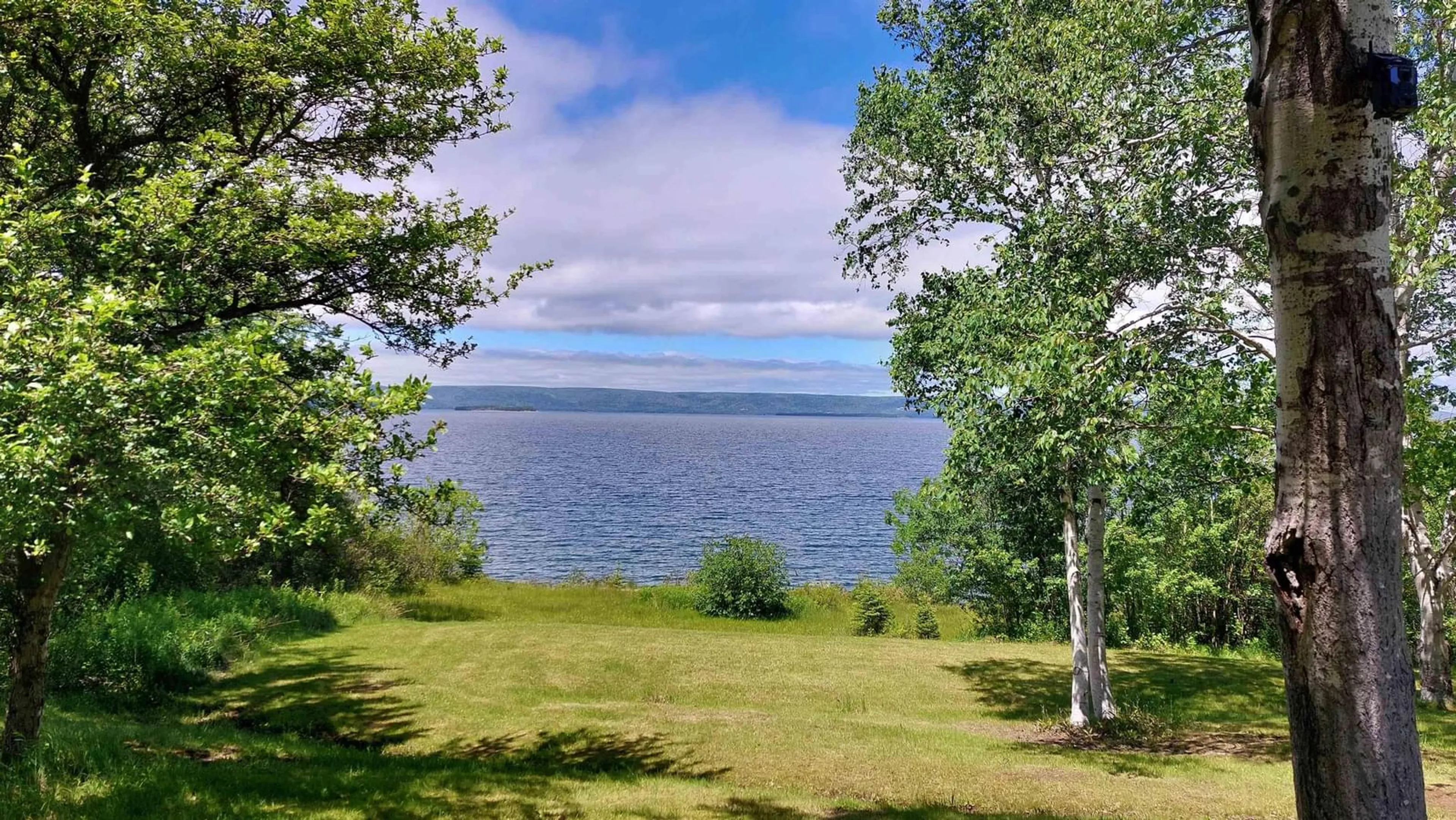 A pic from outside/outdoor area/front of a property/back of a property/a pic from drone, water/lake/river/ocean view for 3653 West Bay Road, St. Georges Channel Nova Scotia B0E 3K0