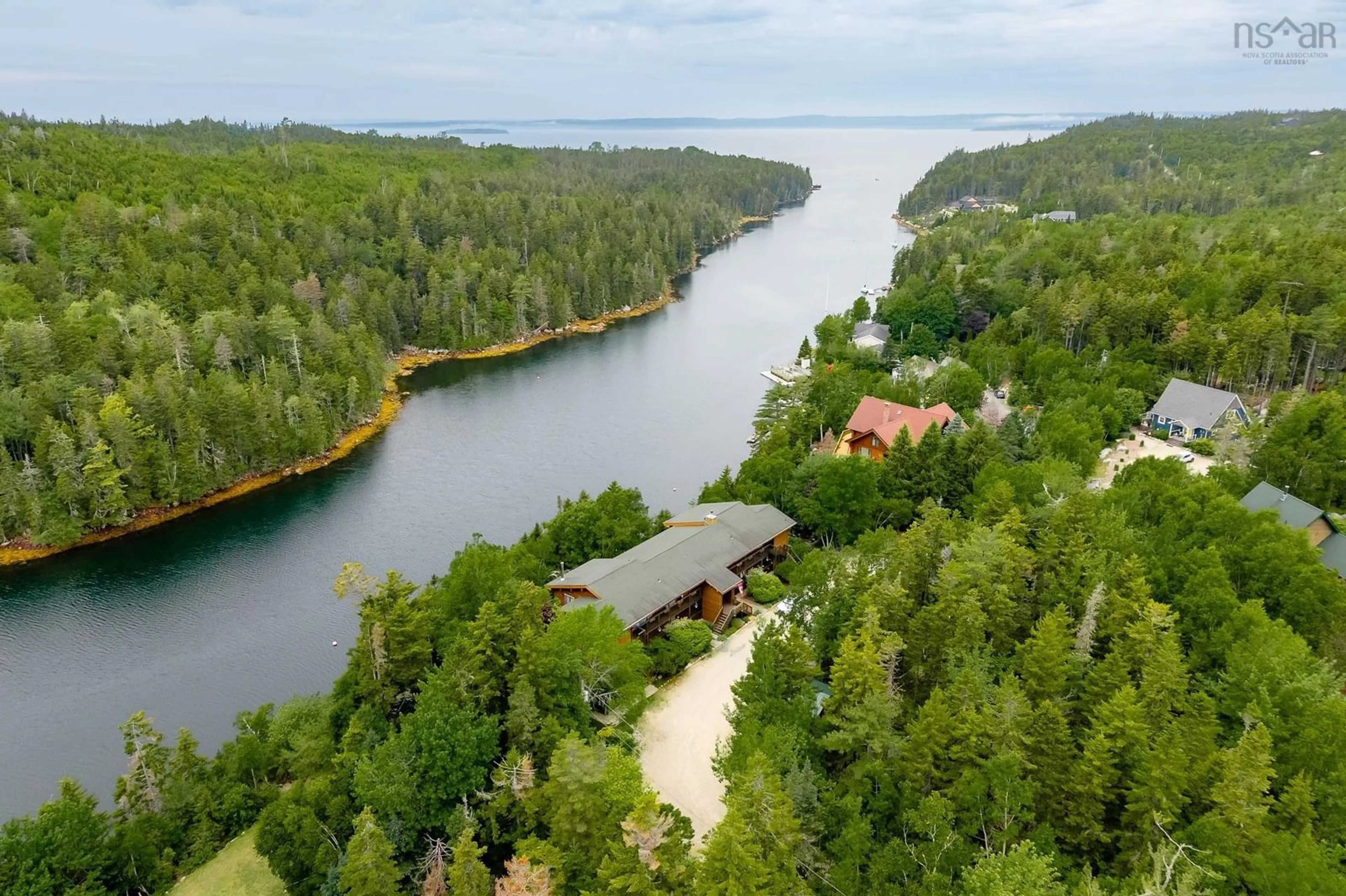A pic from outside/outdoor area/front of a property/back of a property/a pic from drone, water/lake/river/ocean view for 25 Ocean Marina Dr #203/204, Deep Cove Nova Scotia B0J 1T0