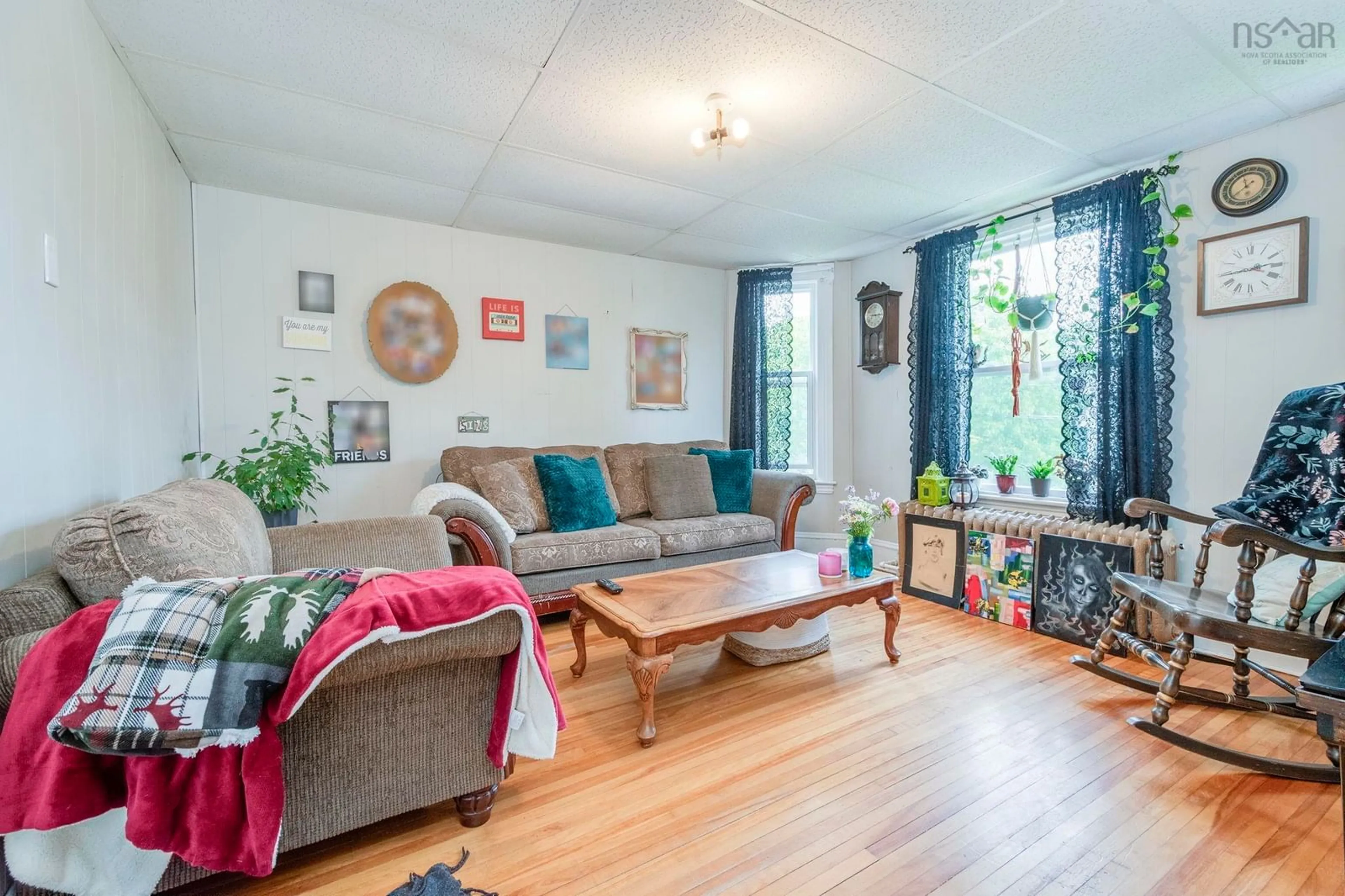Living room with furniture, wood/laminate floor for 128 River St, Stellarton Nova Scotia B0K 1S0