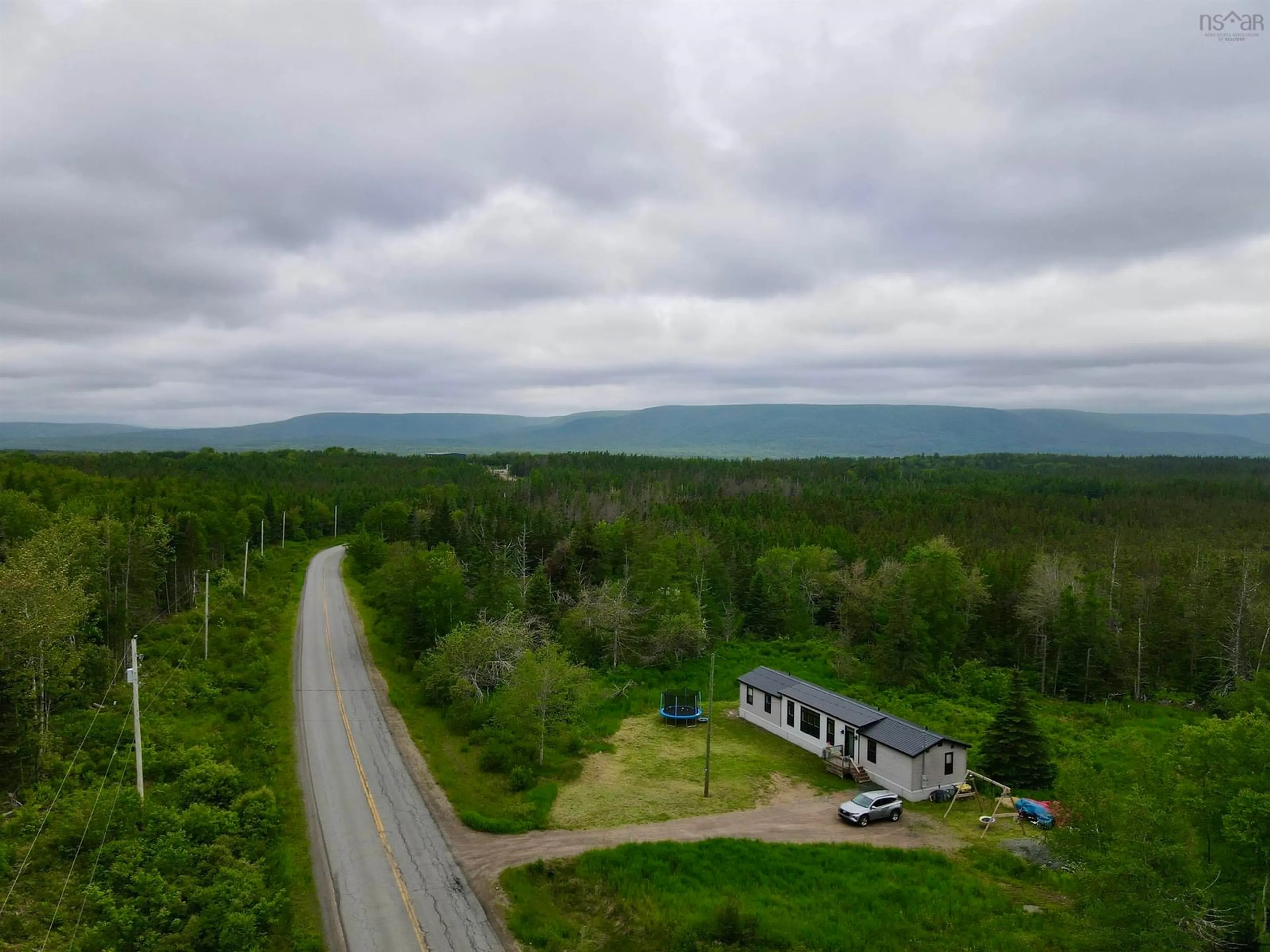 A pic from outside/outdoor area/front of a property/back of a property/a pic from drone, mountain view for 370 Old Margaree Rd, Big Baddeck Nova Scotia B0E 1B0