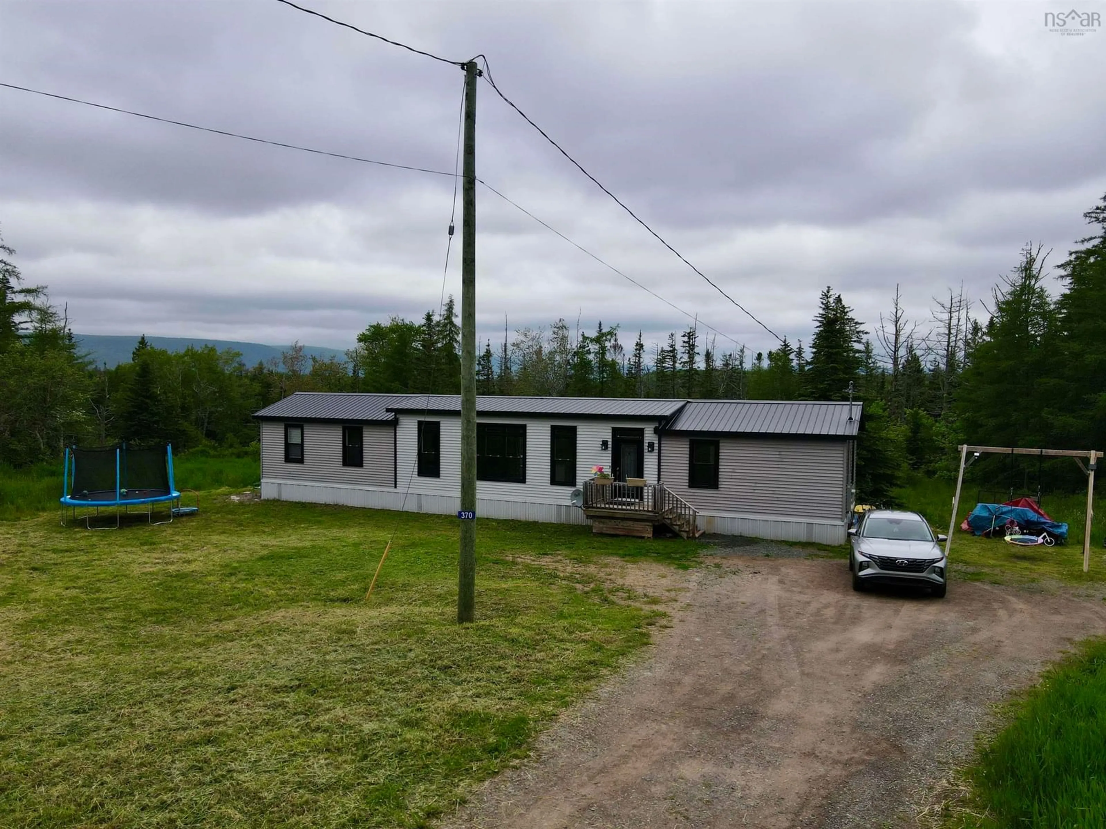 A pic from outside/outdoor area/front of a property/back of a property/a pic from drone, building for 370 Old Margaree Rd, Big Baddeck Nova Scotia B0E 1B0