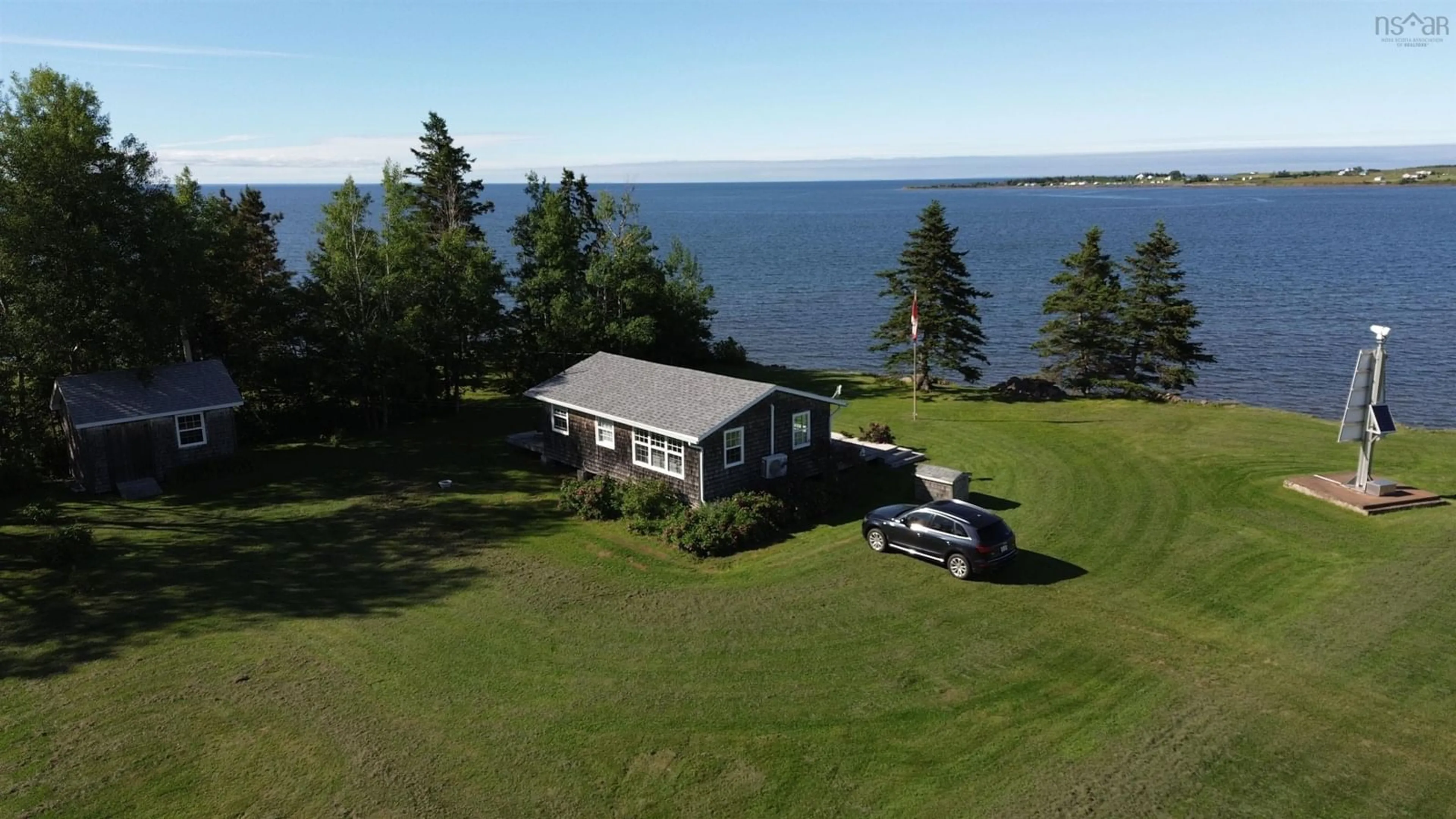 A pic from outside/outdoor area/front of a property/back of a property/a pic from drone, water/lake/river/ocean view for 59 Harbour Lane, Pugwash Nova Scotia B0K 1L0
