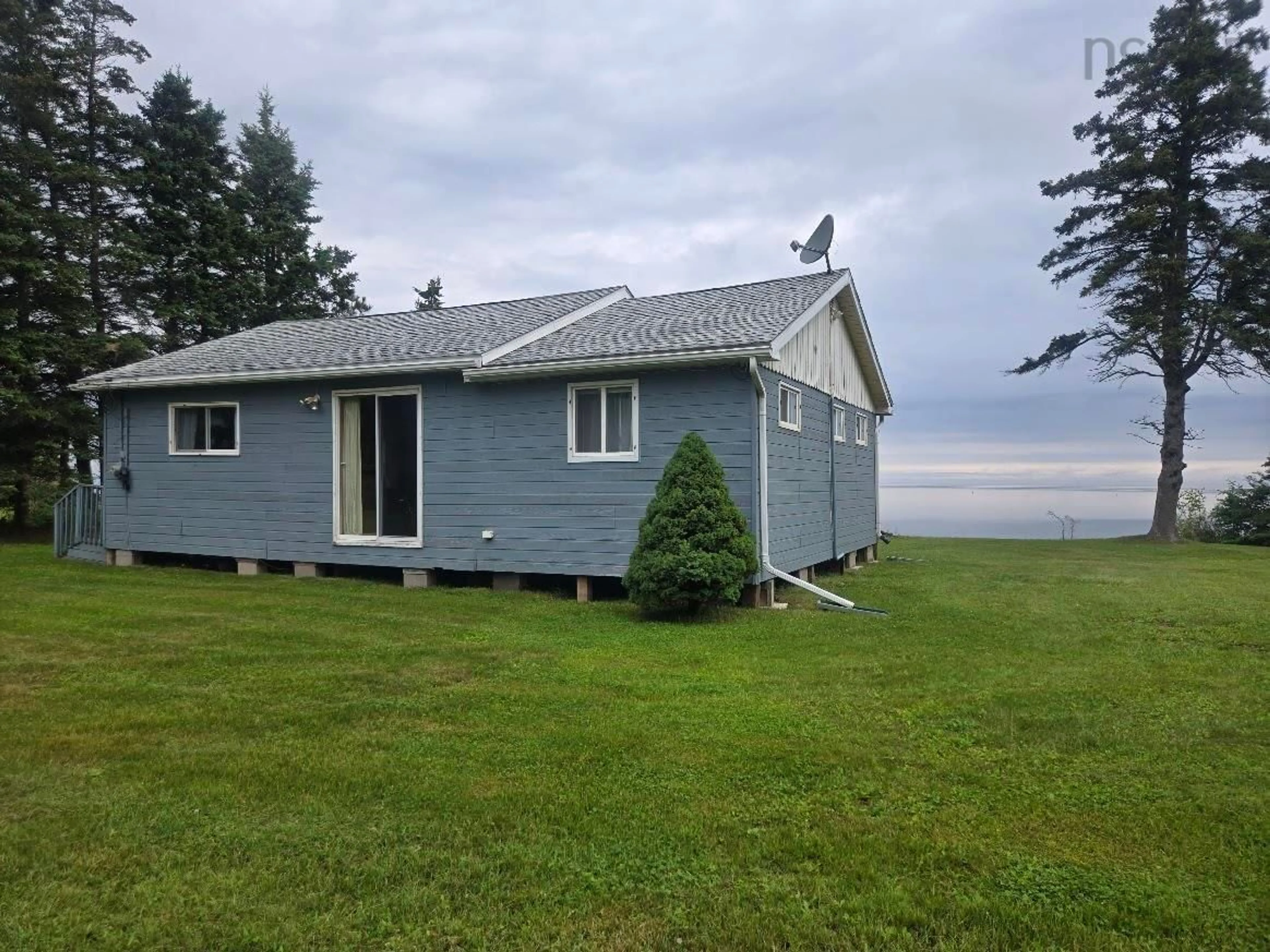 A pic from outside/outdoor area/front of a property/back of a property/a pic from drone, water/lake/river/ocean view for 99 Purdy Beach Lane, Pugwash Nova Scotia B0K 1L0