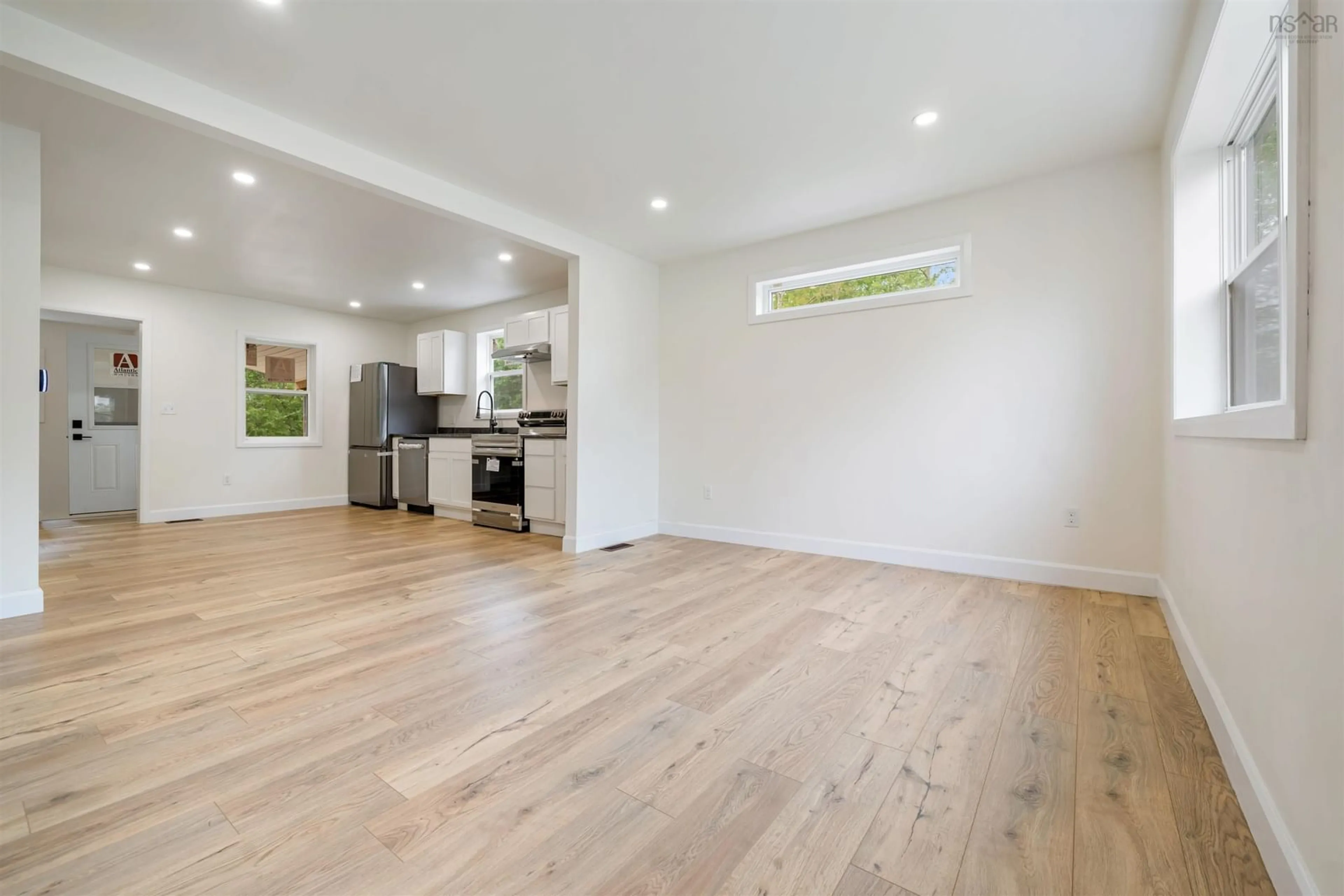 Open concept kitchen, wood/laminate floor for 162 Sixth St, New Glasgow Nova Scotia B2H 1B5