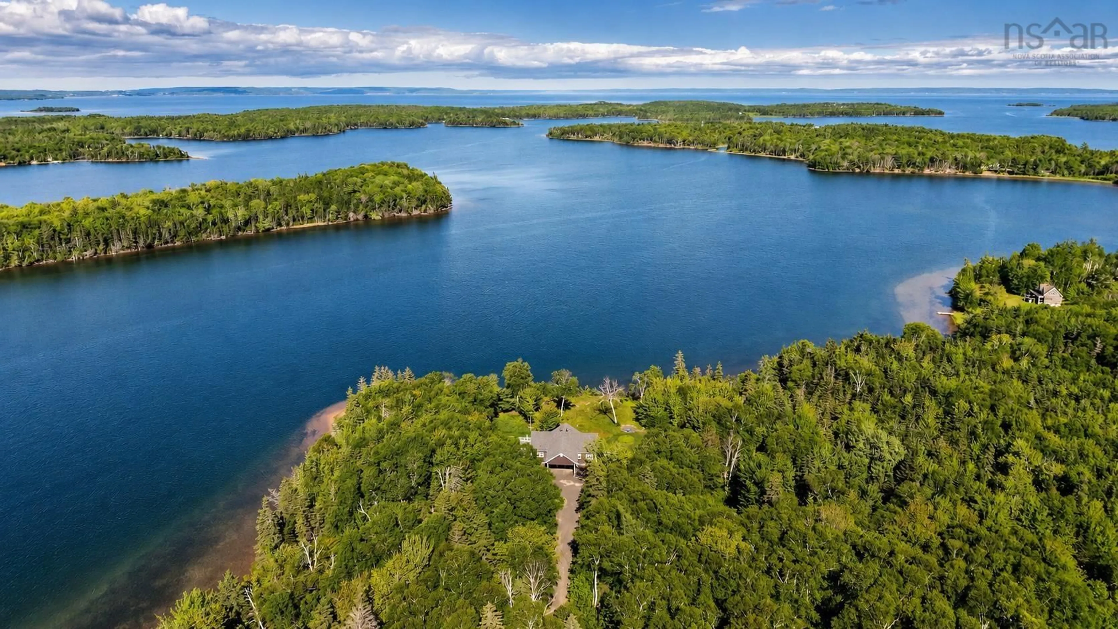 A pic from outside/outdoor area/front of a property/back of a property/a pic from drone, water/lake/river/ocean view for 7548 Marble Mountain Rd, Malagawatch Nova Scotia B0E 2K0