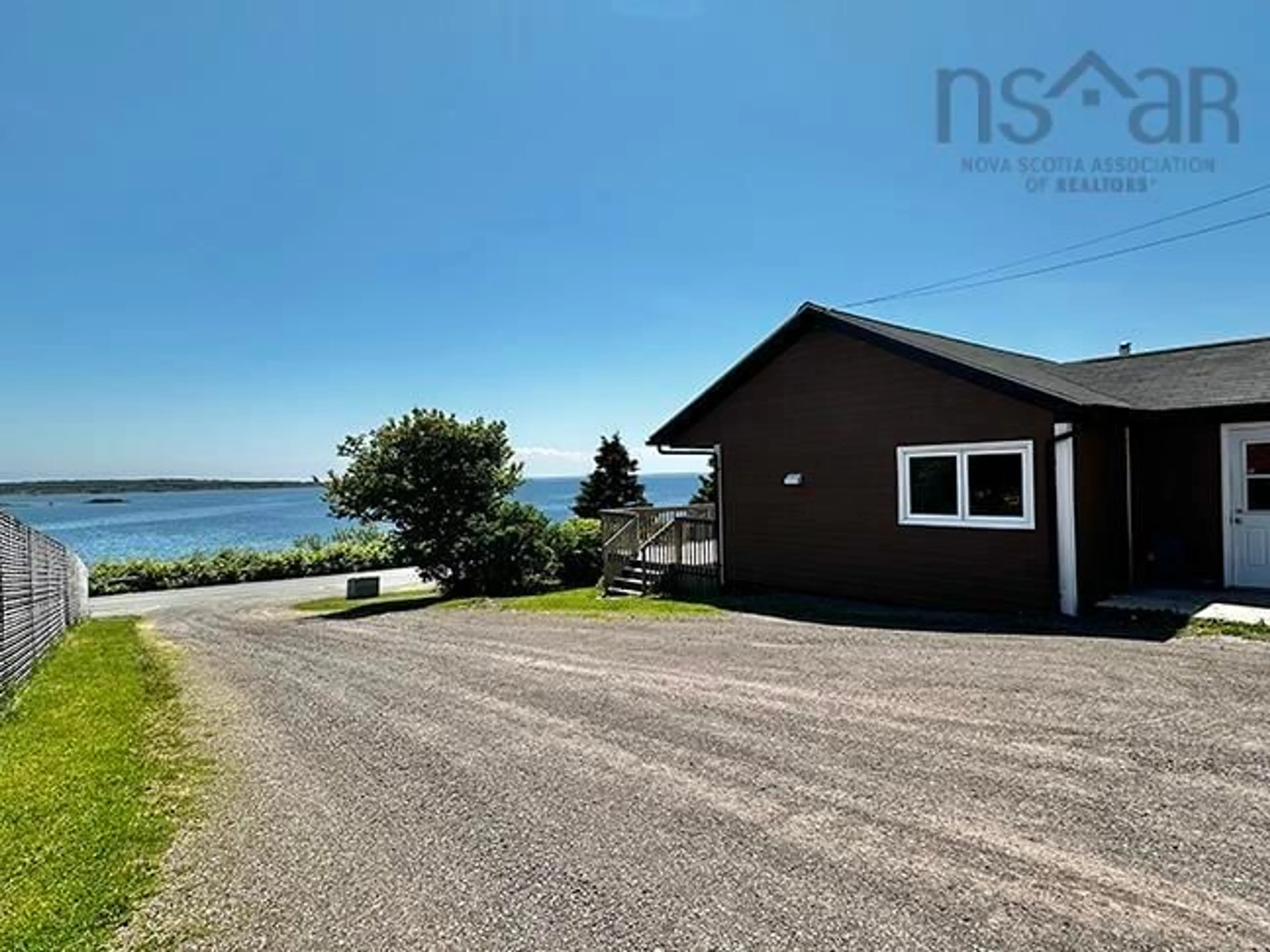A pic from outside/outdoor area/front of a property/back of a property/a pic from drone, water/lake/river/ocean view for 593 Veterans Memorial Dr, Arichat Nova Scotia B0E 1A0
