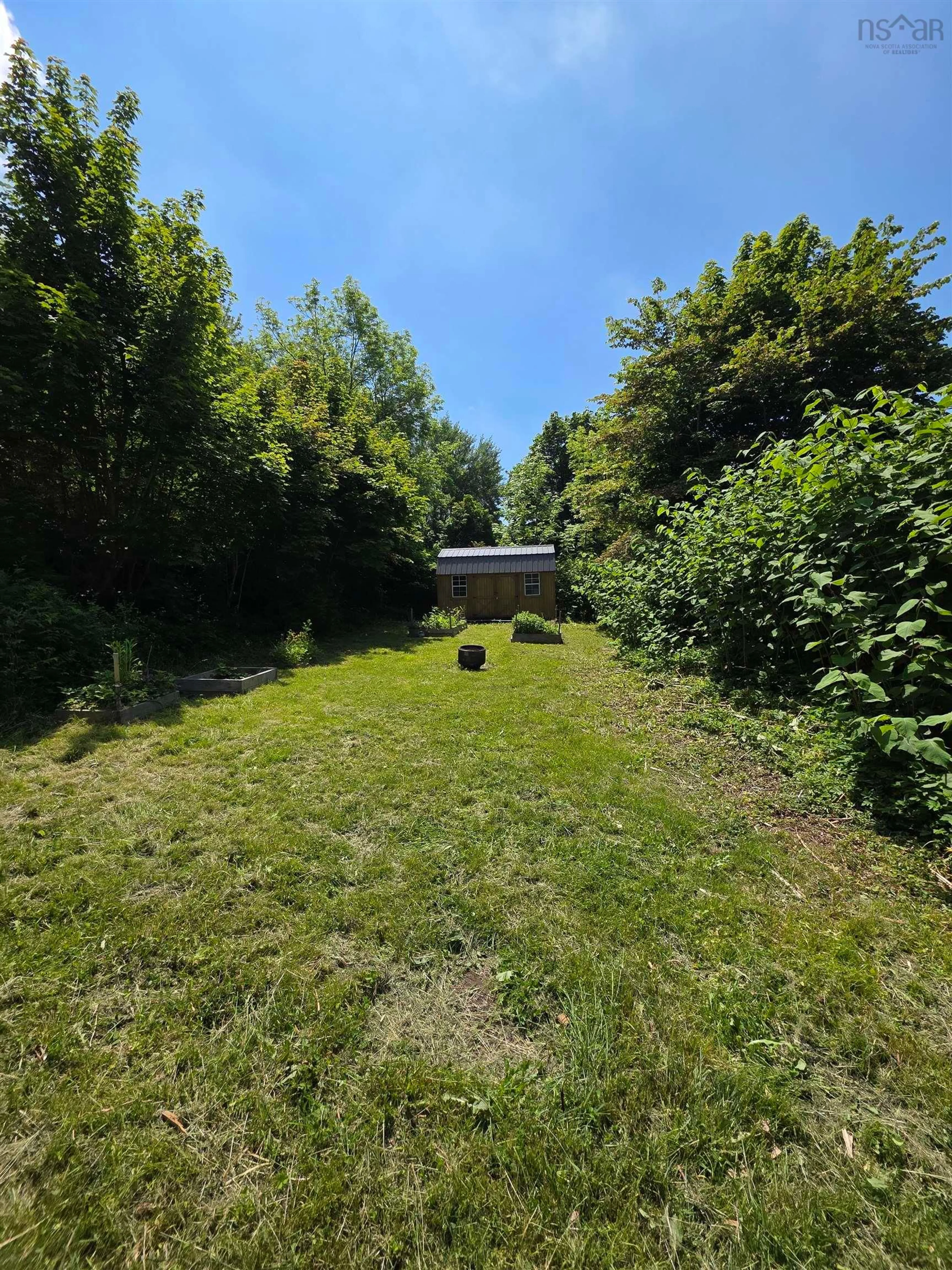 A pic from outside/outdoor area/front of a property/back of a property/a pic from drone, forest/trees view for 922 George St, Sydney Nova Scotia B1P 1M3