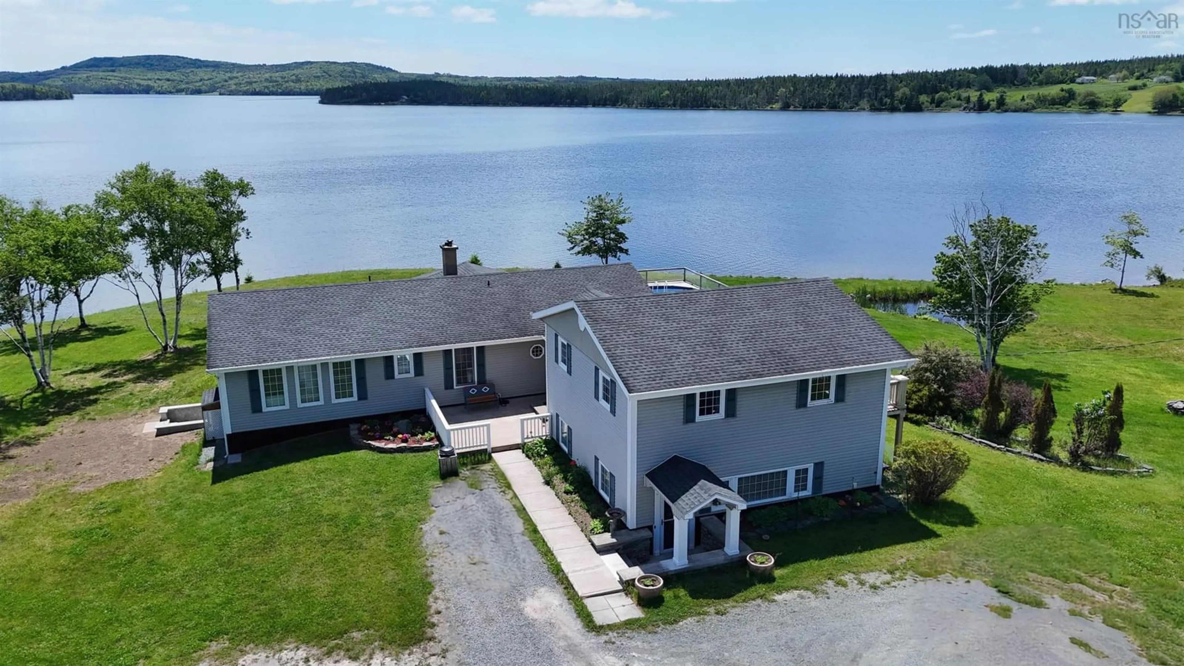 A pic from outside/outdoor area/front of a property/back of a property/a pic from drone, water/lake/river/ocean view for 8265 West Bay Hwy, Sampsonville Nova Scotia B0E 3B0