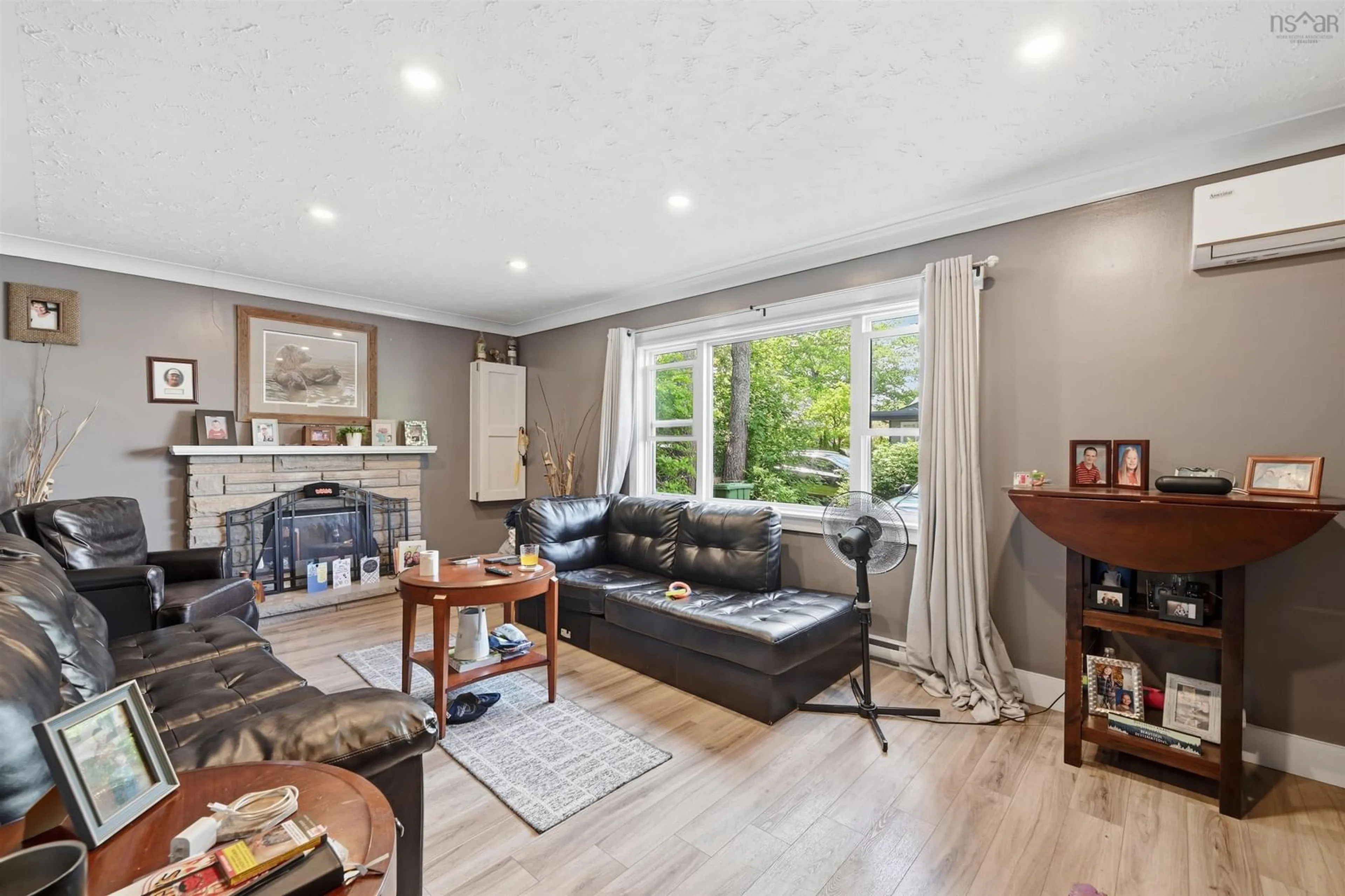 Living room with furniture, wood/laminate floor for 8B Gordon St, Bedford Nova Scotia B4A 2R8