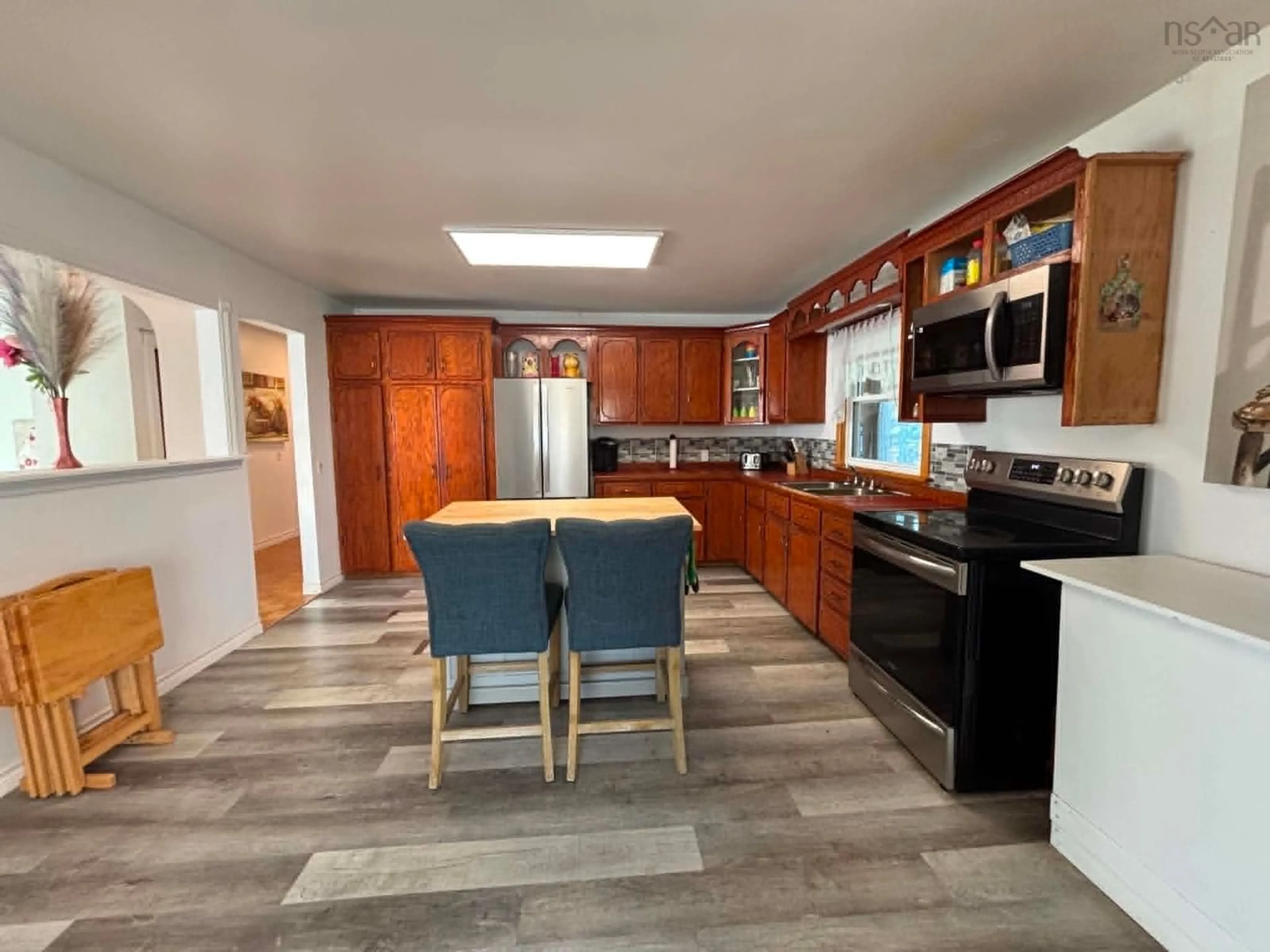 Open concept kitchen, ceramic/tile floor for 32 Chemin Herb Leblanc Rd, Salmon River Nova Scotia B0W 2Y0