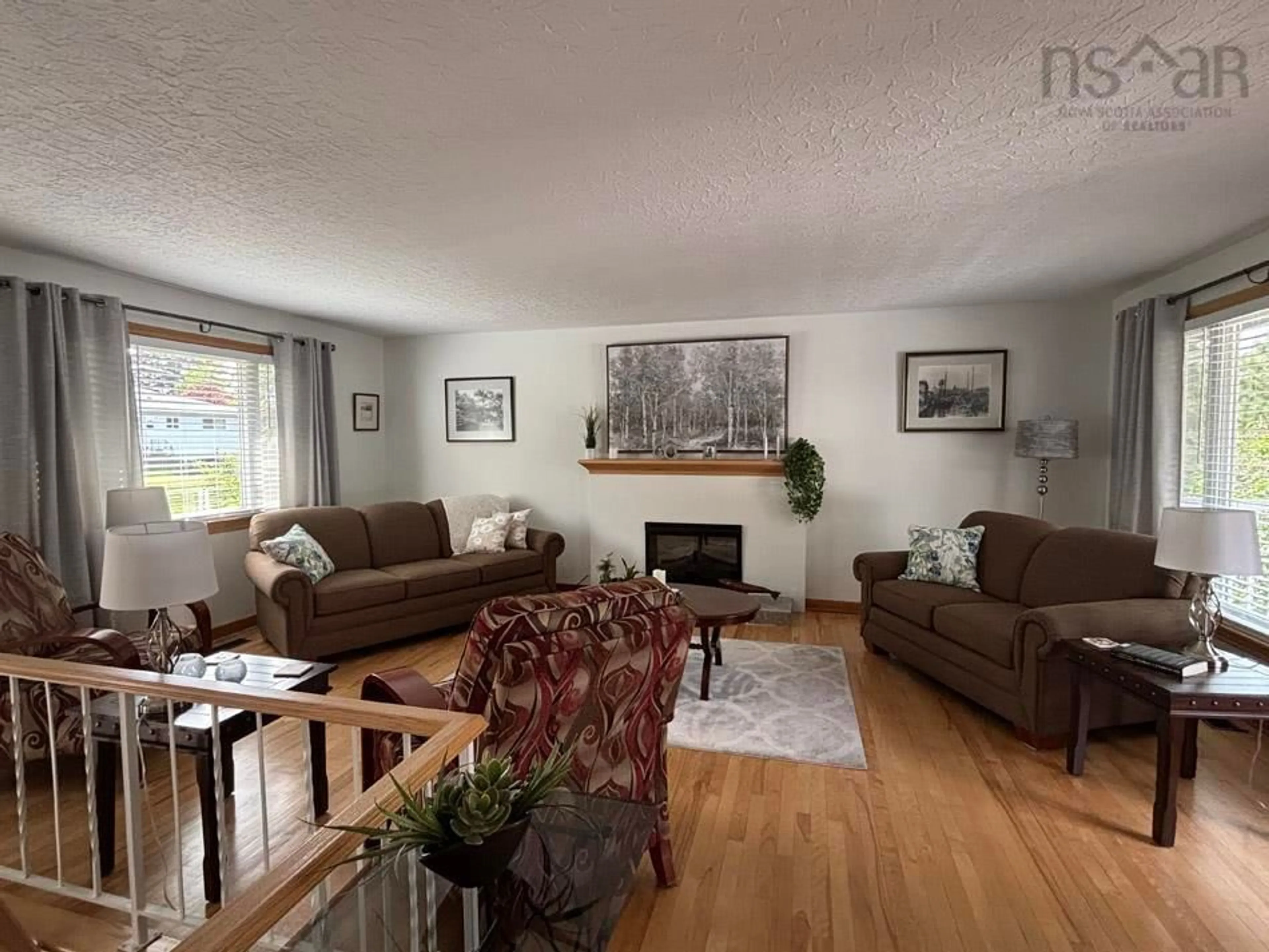 Living room with furniture, wood/laminate floor for 15 Cranston Ave, Dartmouth Nova Scotia B2Y 3G1