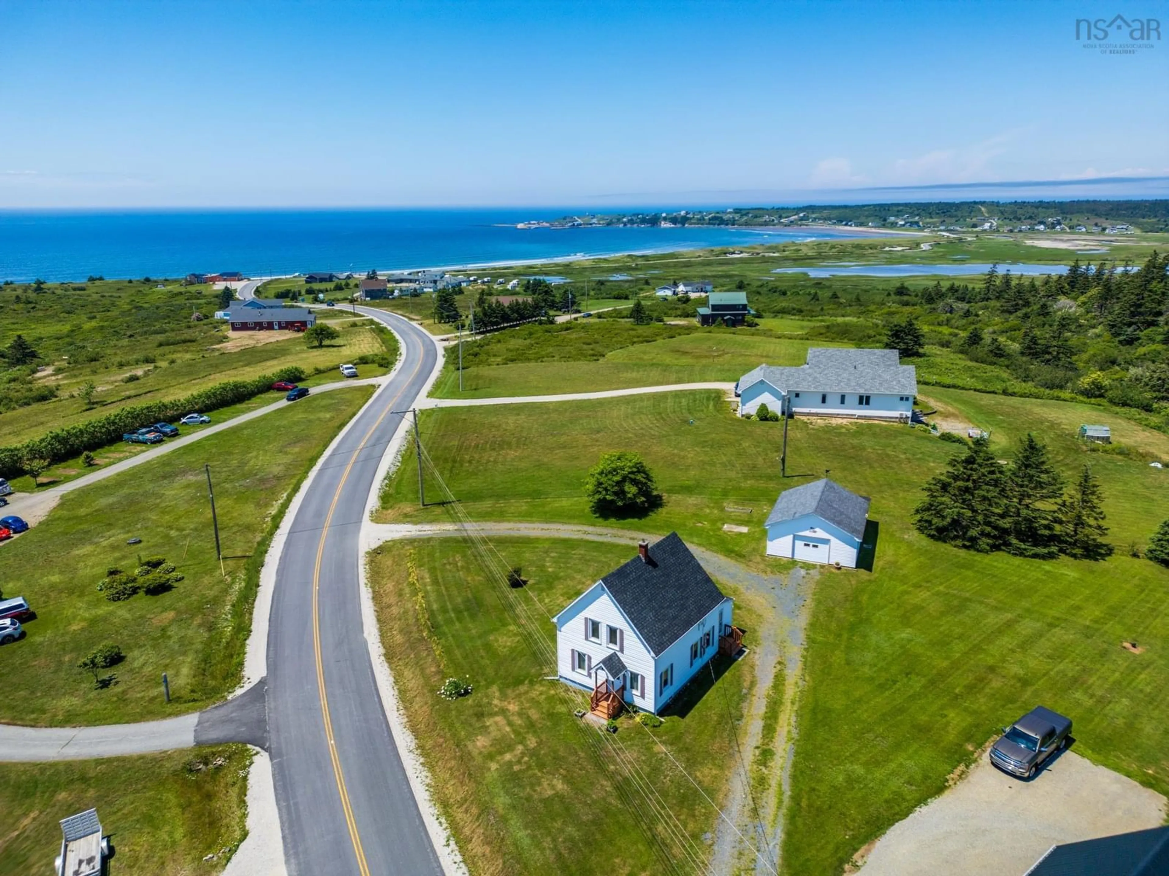 A pic from outside/outdoor area/front of a property/back of a property/a pic from drone, water/lake/river/ocean view for 44 John Doucette Road, Mavillette Nova Scotia B5A 5B4