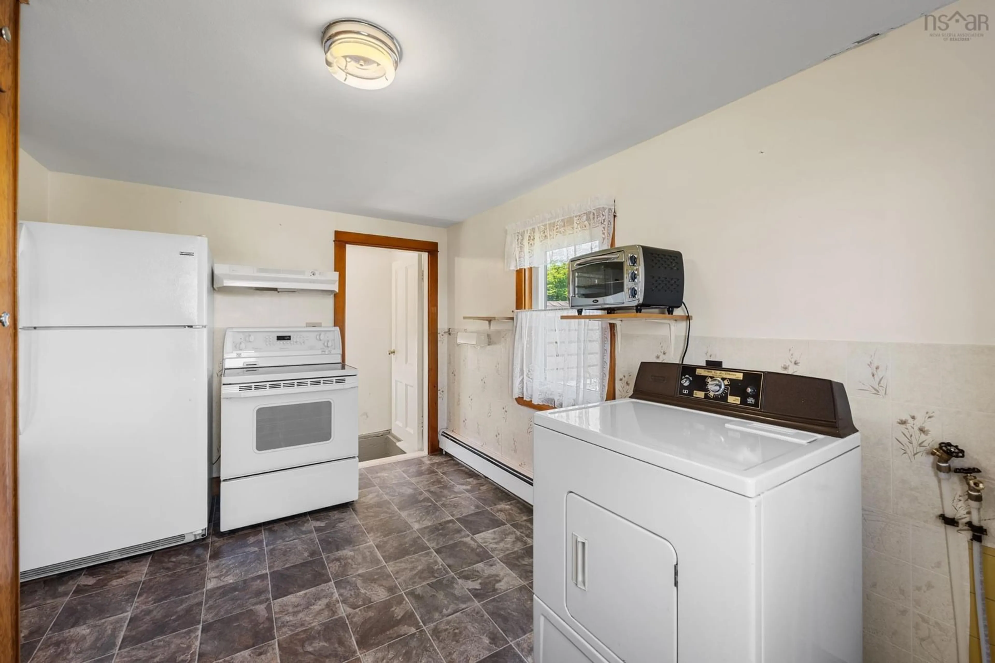 Standard kitchen, ceramic/tile floor for 44 John Doucette Road, Mavillette Nova Scotia B5A 5B4