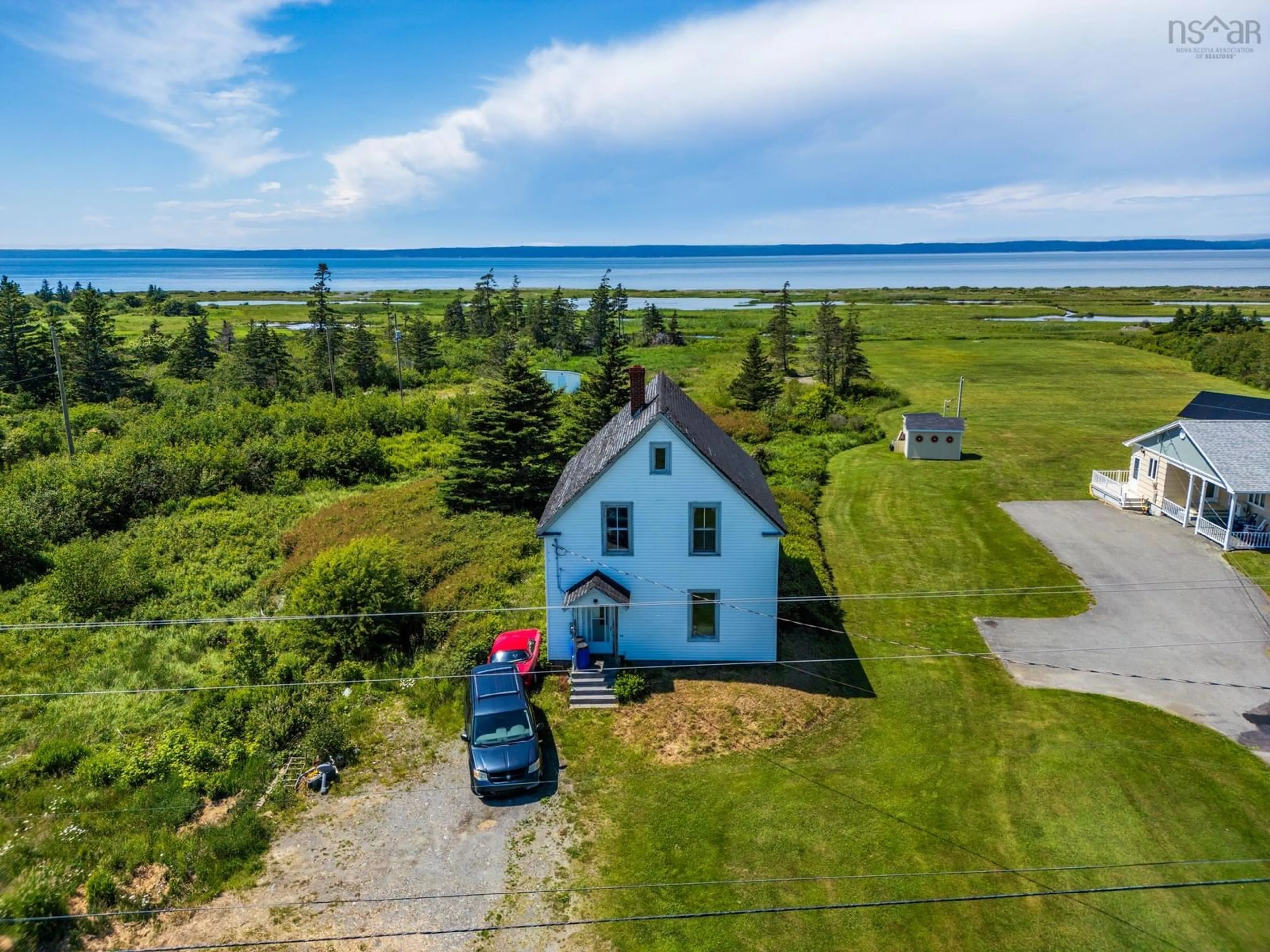 A pic from outside/outdoor area/front of a property/back of a property/a pic from drone, water/lake/river/ocean view for 2337 Highway 1, Grosses Coques Nova Scotia B0W 1M0