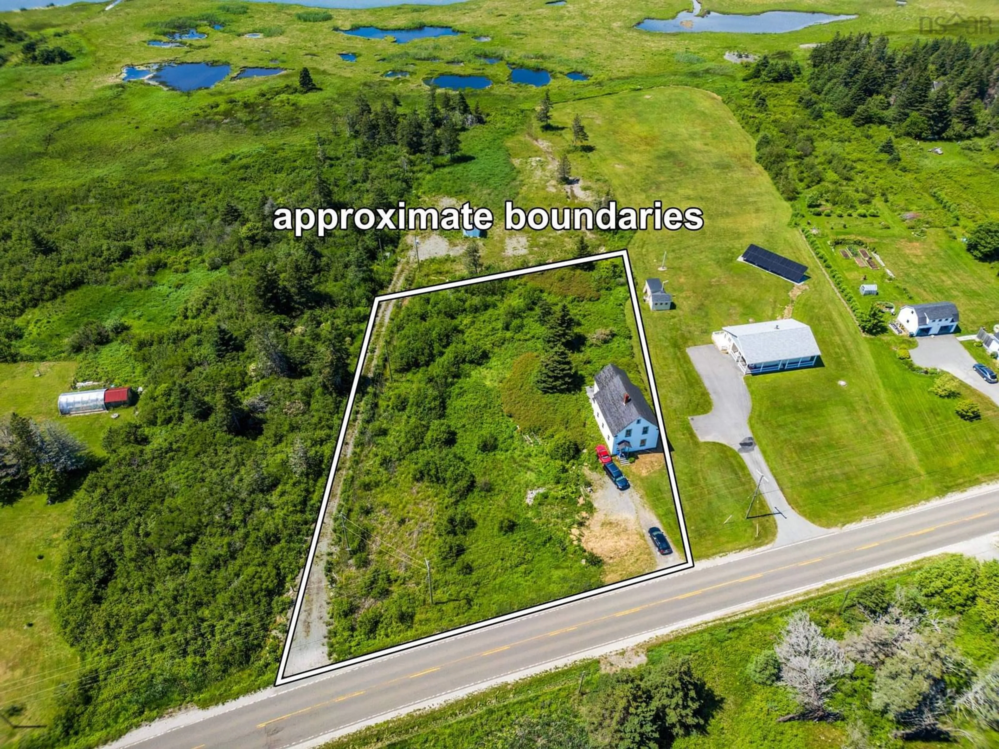A pic from outside/outdoor area/front of a property/back of a property/a pic from drone, water/lake/river/ocean view for 2337 Highway 1, Grosses Coques Nova Scotia B0W 1M0